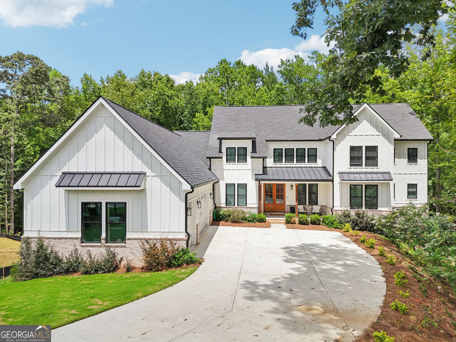PRICE IMPROVEMENT! Custom Luxury Living on the Golf Course in Traditions of Braselton. This beautifully crafted 5-bedroom, 4-bath custom home sits on a private, wooded .54-acre cul-de-sac lot backing up to the golf course. Inside, discover high-end finishes and thoughtful design throughout, including premium LVP flooring, quartz countertops, custom built-in cabinetry, 9' ceilings on main and upper levels & 10' in the lower level. The heart of the home features a gourmet kitchen with a gas cooktop, oversized island, double oven, walk-in pantry, butler's pantry, and breakfast area. The open-concept layout includes a main-level primary suite with a huge walk-in closet with custom shelving and dressing area. The primary bath includes a soaking tub, separate vanities, and an oversize shower with dual shower heads. There is also an additional guest bedroom on the main level and another full bathroom. Upstairs you will find (3) large secondary bedrooms with large closets and two additional full bathrooms. There is walk out attic storage, and oversized office/flex/playroom space for added convenience and versatility. The lower level is heated/cooled and stubbed and ready for finishing. The owner is leaving doors, cabinets and windows that are already on site - just waiting for the new owners to come in and finish for even more bedrooms and living area. Enjoy the outdoors year-round on the screened porch with fireplace and a spot for your tv. The deck and covered patio below offer even more entertainment space. Hang out around the firepit area and play corn hole, pads are already in place or walk to the creek in the back. The extra-deep 3-car garage and 6" gutters reflect the attention to detail in this stunning home. Located in the vibrant Traditions of Braselton community, residents enjoy resort-style amenities including an 18-hole golf course, swimming pool, tennis and pickleball courts, fitness center, clubhouse, scenic walking trails, and regular neighborhood events. Convenient to shopping, dining, and top-rated schools, this neighborhood offers a welcoming atmosphere and lifestyle for all.