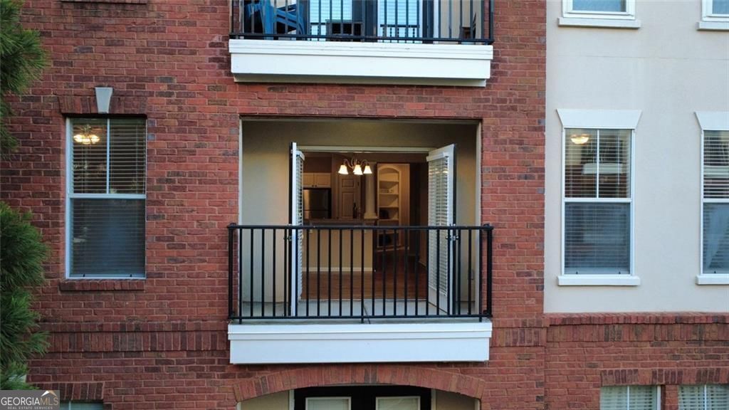 Rare 3-Bedroom Corner Unit in Prime Location at the Madison Square at Dunwoody Condominiums! Opportunities like this don't come along often - this freshly updated corner unit offers generous space with the convenience of gated condo living. Step inside to find brand-new carpet in the bedrooms, a fresh coat of paint throughout, and new windows that flood the home with natural sunlight. The foyer welcomes you with custom built-ins and crown molding, leading into a stylish kitchen with granite countertops, stainless steel appliances, breakfast bar, and room for a dining table. The sun-drenched living room is a showstopper, with four oversized windows spanning two walls - a rare feature reserved for corner units. Step out onto the balcony for your morning coffee and enjoy a view of the community bustle. The spacious primary suite easily accommodates a king-sized bed and features a spa-style bath with soaking tub, dual vanities, and two walk-in closets. Two generously sized secondary bedrooms share another dual-vanity bath with soaking tub - perfect for family, guests, or a home office setup. Additional highlights include a young HVAC & water heater, whole-home water filtration system with independent hot & cold dispensers, two assigned parking spaces, and a generous storage closet. The gated community offers resort-style amenities, including a zen garden, two pools (lap + beach-entry), a fully equipped gym, clubhouse, sculpture garden, grilling areas, and secure parking garages. All this in an unbeatable Dunwoody location - steps to shopping, restaurants, Kroger supermarket, and immediate access to the I-285 interstate, convenient to GA-400 & I-85 for easy commuting. This property won't stay available long.