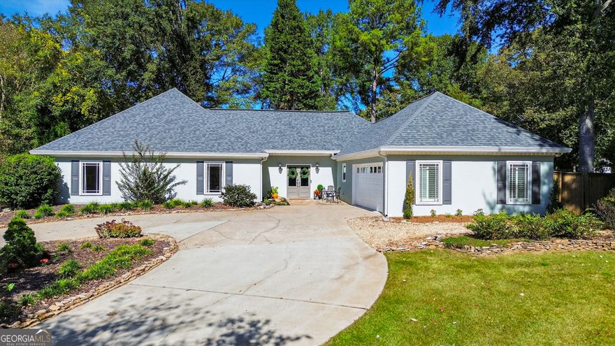 Splendid ranch living on an ideal lot, with a full luxury renovation complete for your enjoyment! The location is the cherry on top: a part of Downtown Alpharetta, easy access to EVERYTHING, and districted to 3 highly coveted schools.  We are pleased to present this uncommon true ranch for your consideration! Although the floor plan showcases distinct living room, dining room and kitchen, they are connected seamlessly for maximum enjoyment. Gorgeous vaulted living space with cozy stone fireplace. Luxurious kitchen with all the latest fittings: quartz counters, full overlay cabinets, stylish backsplash taken to the ceiling, beautiful lighting, Walk in pantry with wood shelves. New LVP floors throughout the home in the perfect stain color. Updated powder room. Wander to the primary suite; remodeled to impress! New vanity, quartz counters, all new walk-in shower with frameless glass, and fashionable tile. 2 other bedrooms en suite to a jack-n-jill renovated bath. Check these off your to-do list: new front door, new hardcoat stucco, replaced double pane windows, almost new tankless water heater, expanded electrical panel. Enjoy the breathtaking yard from the patio: large, level, fenced, landscaped with sun drenched grass and a perimeter of hardwoods. Ideal scenario if you are dreaming of leveling up your backyard amenities to add a pool, screened porch or outdoor kitchen! New storage shed. Charming Andover North boasts a community pool and playground. Come enjoy the good life on Dover Ave.