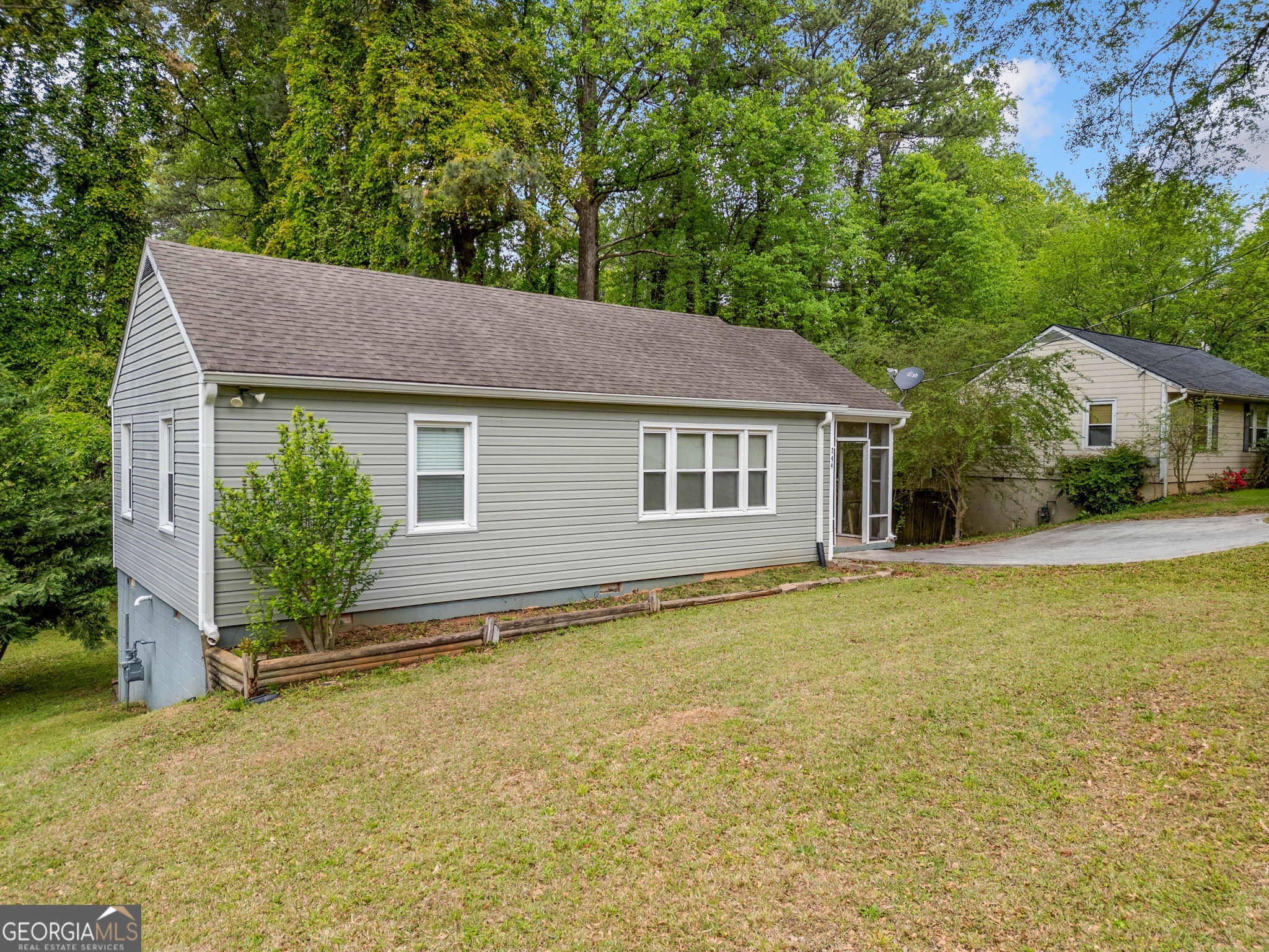Quiet Neighborhood and Circle Street with easy access to I-75, 41, 120 loop and off-campus Kennesaw State University. Near Truist Park, Shopping and Restaurants. No HOA and No Rental Restrictions make this home have endless possibilities. Enjoy the outdoors on your Screened-in Front Porch or Covered Deck while viewing the large, wooded backyard. The Stand-up Crawlspace has been used for Workshop and Lawn Equipment Storage. Less worry with low maintenance Vinyl Siding and Double-pane Windows. Ready to move in with Freshly New Paint and the Refrigerator, Washer / Dryer remaining.