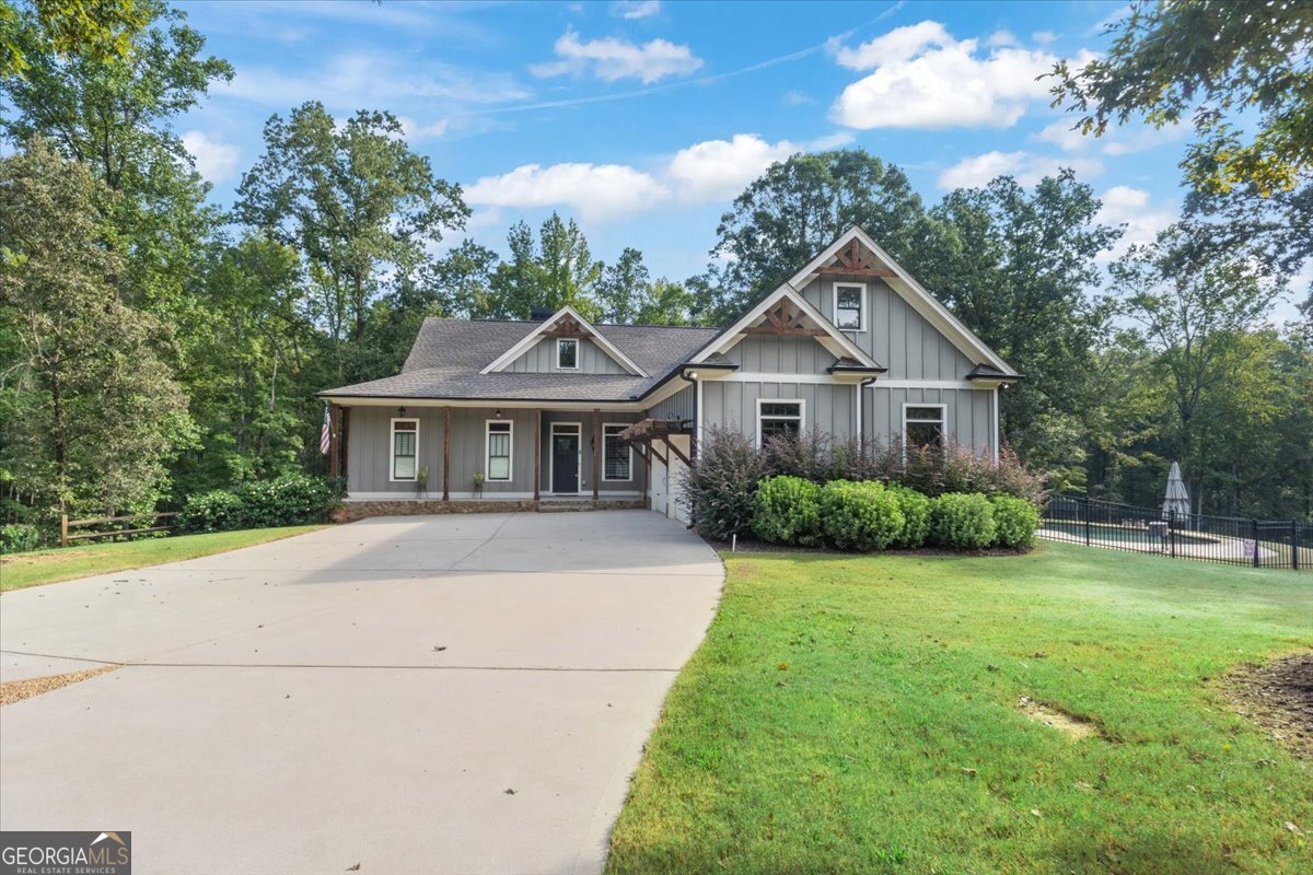 Experience refined country living at its finest in this exceptional 5-bedroom, 4-bathroom home, gracefully set on 10 acres within the prestigious River's End community. Designed for both comfort and entertainment, the open family room flows seamlessly into a chef's kitchen complete with convection oven and stainless steel appliances. Relax in the luxurious main-level owner's suite featuring a spa-like soaking tub, separate shower, and expansive walk-in closet. Enjoy all the extras of the expansive trim and loads of modern upgrades in this beauty! The finished terrace level offers a full kitchen, two bedrooms, two baths, and endless possibilities for hosting guests or creating a private retreat. Perfect area for an in-law suite or perhaps for teens! Outdoors, your private gunite pool awaits, offering a tranquil backdrop for gatherings with breathtaking views. Enjoy 1000mbps Fiber Internet, access to two common areas situated on the Apalachee River, a boat ramp, fishing dock, kayak storage, scenic trails, and community fire pits - all in a serene, nature-rich setting. Located within the highly rated Morgan County School district and convenient to Madison, Monroe, and Athens, this extraordinary property delivers both luxury and lifestyle!