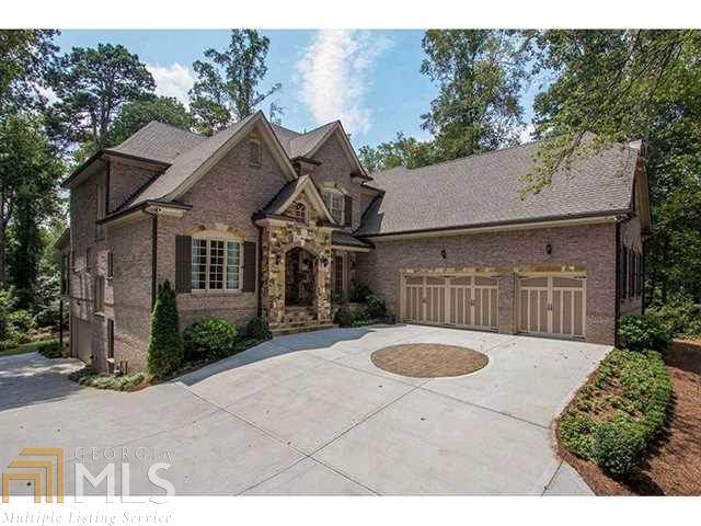 Almost new John Willis built in North Buckhead. 4 sides brick and stone traditional with 2 story foyer, coffered ceilings, wrought iron, dark stained hardwood floors and the most beautiful kitchen! Sealed granite counters matched with an amazing textured back splash, High end appliances including 2 wine coolers. 2 master suites, one up and one down both with huge closets and sitting rooms. John Willis finished basement includes lg rec room & bar, bedroom and bath. 5 bays of garage, 3 on main level and 2 drive under side rear. Elevator shaft. Private yard. Amazing!
