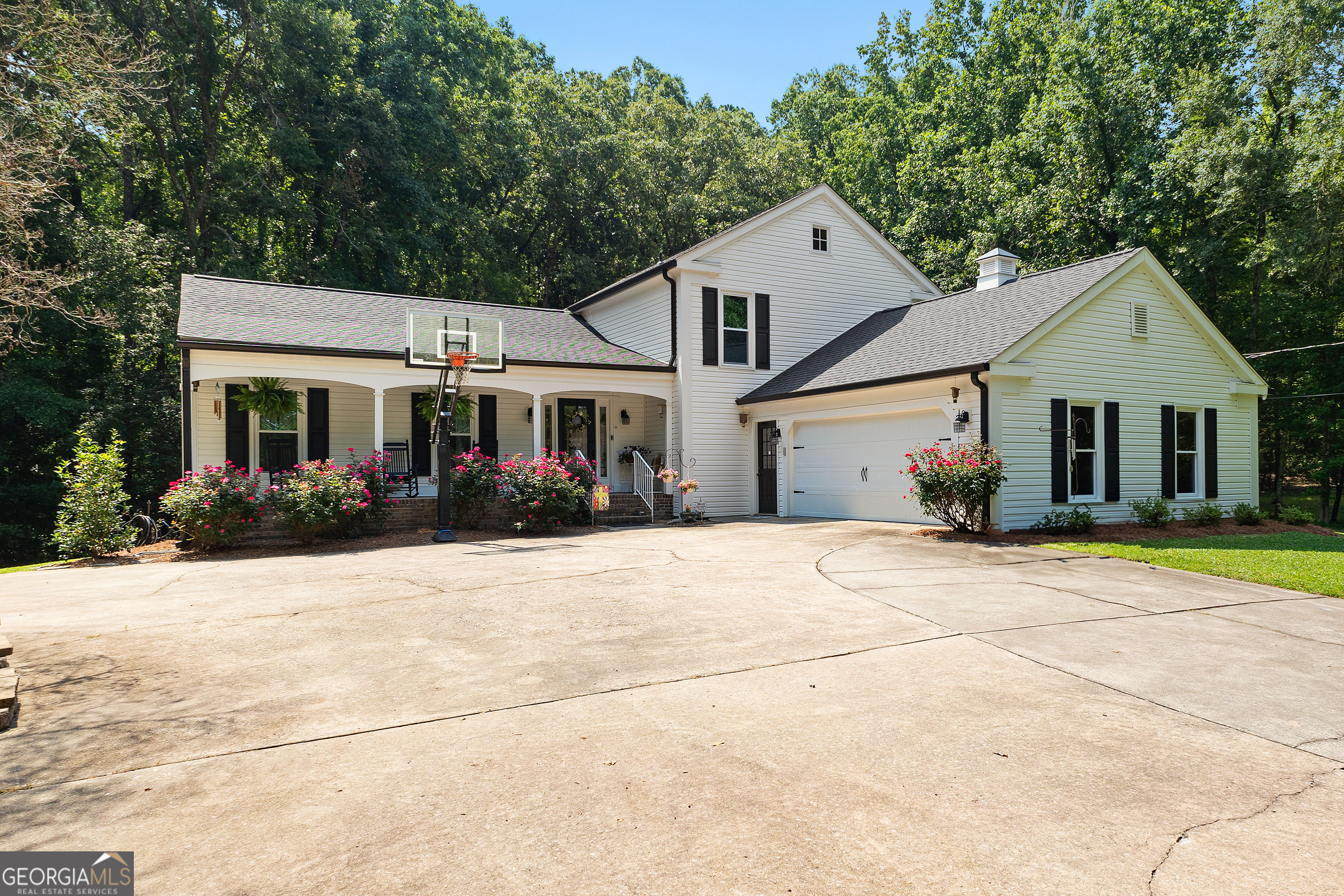 Welcome to your private retreat nestled in Chattahoochee Hills-where rolling land, quiet mornings, and starry nights become your everyday backdrop. This spacious 5-bedroom, 3.5-bathroom home offers over 3,000 square feet of well-maintained living space, perfectly designed for comfort, entertaining, and room to grow. Set on 10.62 acres, this property offers the ideal blend of privacy and convenience, just minutes from Serenbe and its renowned and vibrant farmers' markets. Inside, you'll find a flowing layout with generous living spaces, a bright kitchen, and ample natural light throughout. The home has been meticulously cared for, with a NEW ROOF, New Siding, and New Energy-Efficient Windows. Whether you're looking for a homestead, a multi-generational home, or your slice of rural living, this property is the one. Two parcels will be sold as one for a total of 10.63 acres.
