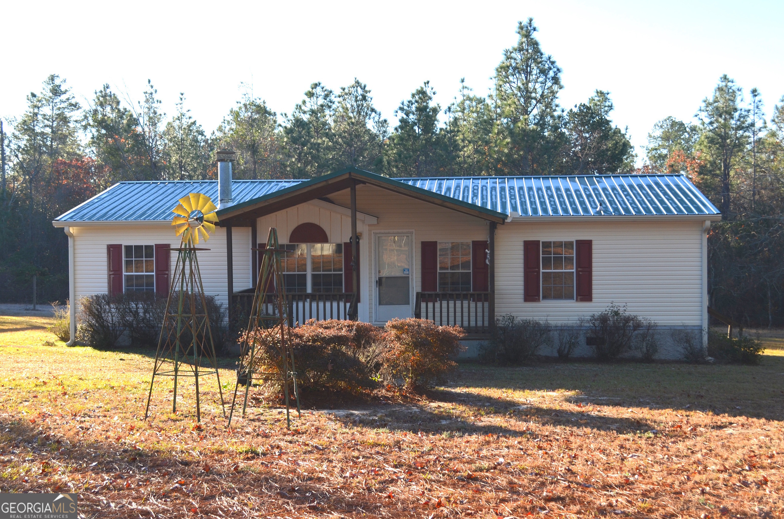 Country Living at its Finest! Are you looking for Privacy? This is the Property for You!  3 Bedroom, 2 Bath Mobile Home on a permanent foundation with a New Hot Water Heater, New LVP Flooring throughout, and a New Dishwasher. Home also includes a Gas Fireplace, Front and Back Porch, 2 Covered Parking Areas and a Workshop that is set up to be wired. This 2.8 acres offers a lot of potential to make it your own! If You are ready for your own Private Oasis, Call to Schedule a showing today!