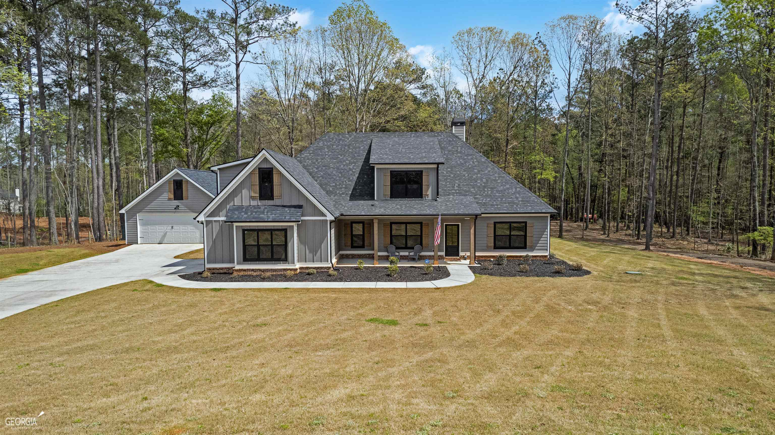 Welcome to your dream home! Nestled on just under 10 acres, this stunning property offers ample space and privacy for your family to enjoy. You can start your day with a peaceful morning run or walk without ever leaving your property. As you explore the land, you'll hear the soothing sound of running water from the stream that runs through the back of the property. The house itself is a true gem, boasting an impressive 2 years of age and offering all the modern amenities you could ask for. The 4 board fencing and gates along the front provide an added layer of security, while the additional driveway allows easy access to the back acreage. The detached 28 x 32 second garage is perfect for storing all of your tools and toys, and features loft trusses, an 8' x 18" door in the front, and an 8 x 10 door in back. Inside the house, you'll fall in love with the spacious and open floor plan. The vaulted family room is the perfect place to relax and unwind, while the huge island with sparkling Quartz countertops is a chef's dream come true. You'll appreciate the ample storage space provided by the walk-in pantry and laundry room which is plumbed for a sink, which features enough space for a second fridge or freezer. The main floor master suite is a true oasis, with a spa-like bathroom and a walk-in closet that is the size of a small bedroom. Two additional bedrooms and another full bath are also located on the main floor, providing plenty of space for your family and guests. Upstairs, you'll find an additional bedroom, full bath, and large bonus room, which can be used for anything from a home office to a playroom. This home is packed with extra features that will make your life easier and more comfortable, including high-speed Gig internet through Spectrum, spray foam insulation. The majority of the property has also been forestry mulched to open up the land and create even more space for you to enjoy. The entire property is survey marked with blue ribbon. In summary, this property offers a rare opportunity to enjoy a spacious and modern home on just under 10 acres of land. With so many extra features and a prime location, this home won't stay on the market for long. Don't wait - schedule your showing today!