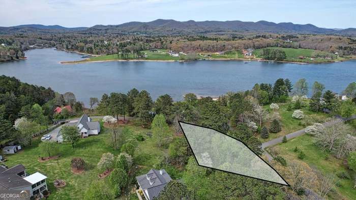 Private Lot in Established Neighborhood with Potential Views Discover this private lot nestled in a beautiful, well-established neighborhood. Enjoy the potential for stunning lake and mountain views, depending on your home's placement. Located on paved roads with utilities available at the street. A soil test will be required. This is a fantastic opportunity to build your dream home in a desirable convenient location!