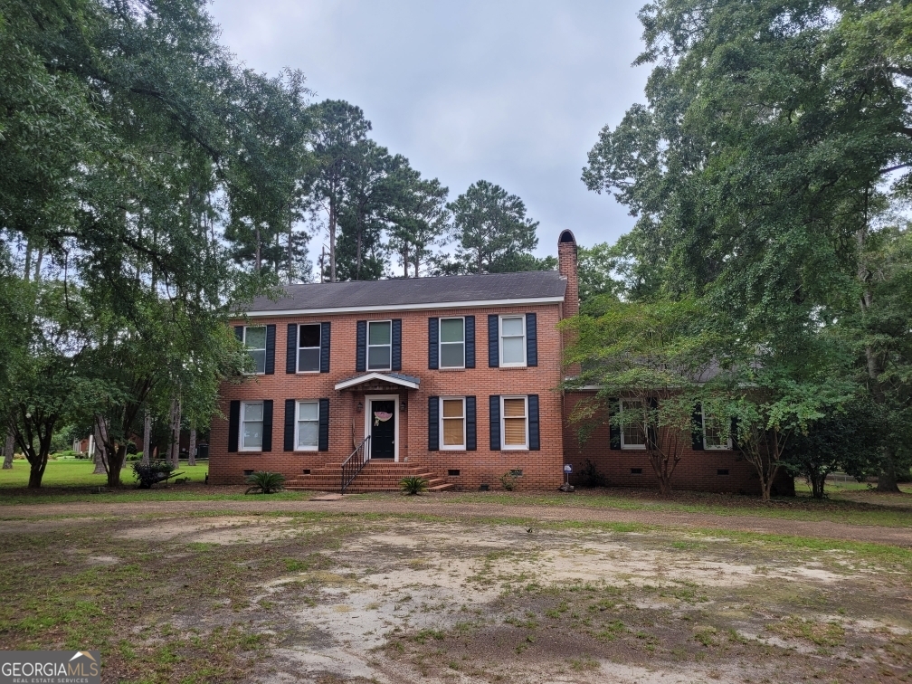 Welcome to Woodlawn Estates, one of Eufaula, Alabama's premier neighborhoods! This fine brick home on a spacious corner double lot is waiting for her new family. You will love all it's features including a large family room with a wood burning fireplace, bonus room that could be a game room or a fourth bedroom, living, dining, kitchen with breakfast nook overlooking the back deck and pool. Downstairs there is a full bath and lots of storage, Upstairs the spacious master bedroom has a lakeview, large bath with separate tub and shower as well as a sitting/nursery areas with it's own closet. Two additional bedrooms and a bath are upstairs. Make arrangements today to be one of the first to view this property.