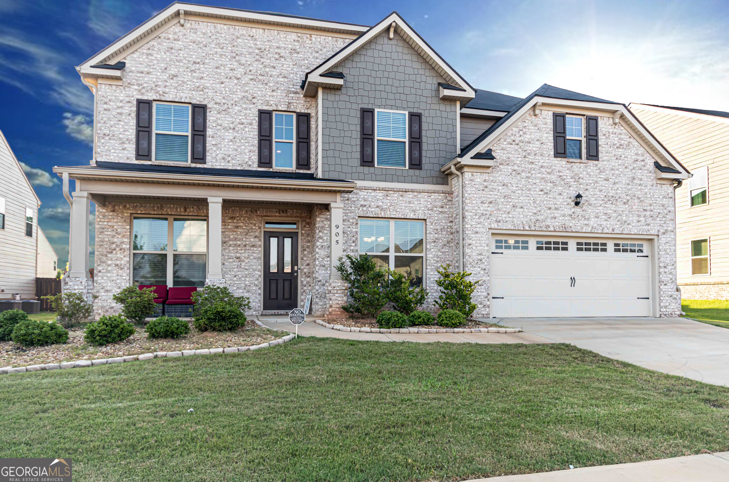 Welcome to The Gates at Pates Creek-luxury living at its finest! This beautiful 5-bedroom, 3-bathroom home is nestled in a gated community featuring top-tier amenities including a sparkling swimming pool, walking trail, and playground, with EASY access to I-75, tons of nearby shopping, dining, and award-winning schools. Step inside to a home designed for both comfort and elegance. The expansive island kitchen flows seamlessly into a huge family room with fireplace, perfect for entertaining or cozy nights in. Upstairs, retreat to your private owner's suite featuring a cozy fireplace, separate seating area, and a spa-like bath complete with a separate soaking tub, walk-in shower, and generous walk-in closets. With a guest suite on the main level, spacious bedrooms, and thoughtful finishes throughout, this home offers space and style in all the right places.