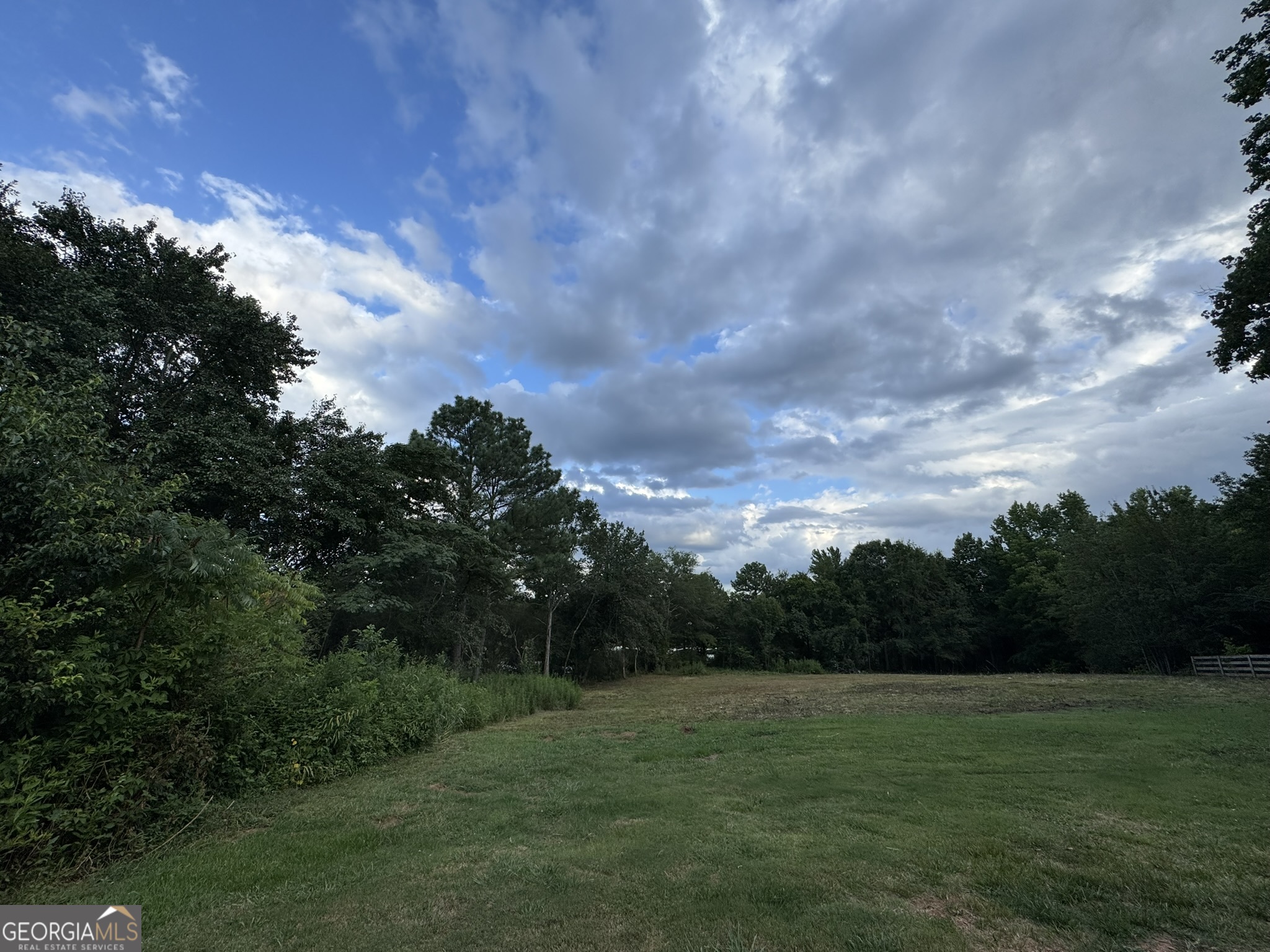 Investor Special! This is 0.77 acres land, cleared, level and ready to build a dream home. This lot is permitted for many uses. close to downtown Cumming. Next to the bungalow home is also for sale. Combined lot size is about one acre. Open House on Saturday and Sunday between 2pm and 5pm.