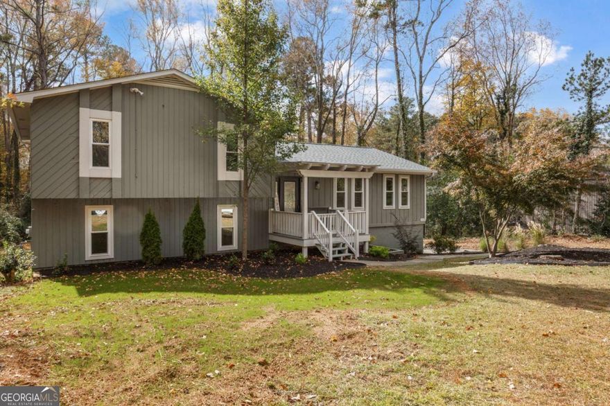 Beautifully Renovated Home on a Large, Level Lot in East Cobb!    Welcome home to this completely renovated 4-bedroom, 3-bath beauty tucked within a quiet, well-kept neighborhood in a great East Cobb location. Every detail has been thoughtfully updated to blend timeless design with modern comfort.    Step inside to an inviting open layout featuring new luxury vinyl plank flooring throughout, fresh interior paint, and stylish new fixtures. The designer kitchen is the heart of the home-showcasing a large island with seating, farmhouse sink, brand-new stainless steel appliances, soft-close cabinetry, and a view into the spacious living room with a cozy fireplace and elegant arched transitions. The remodeled bathrooms exude modern style with beautiful tile-work, sleek vanities, and premium finishes. Enjoy peace of mind with a brand-new roof, gutters, siding, new blown-in insulation, exterior paint, windows, and a new back porch-all set on a large, level lot ideal for play, gardening, or entertaining.    Located minutes from shopping, grocery stores, parks, and top-rated schools, this home offers the perfect balance of convenience and comfort. The neighborhood also features an optional swim/tennis and playground, giving you access to an active community lifestyle without mandatory fees.    This move-in-ready East Cobb gem truly has it all-modern updates, stylish design, and a spacious yard in a fantastic location. More pictures coming soon!