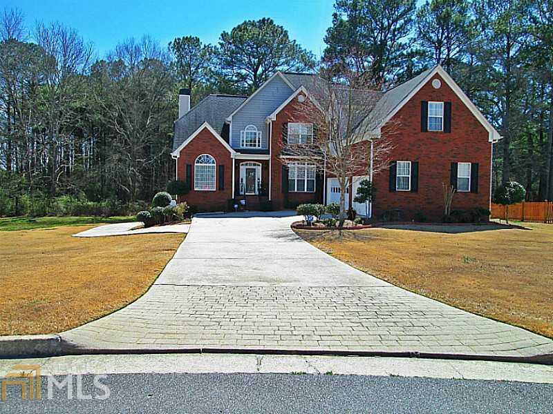 THIS FINISHED BASEMENT IN POWDER SPRINGS IS AWAITING YOU! This home has SPACE, SPACE, and more SPACE. Do you have a Large family, live in in-laws, disabled family member, or just need more room??? Well this is the "PERFECT HOME" to fit all of those needs. This Impressive Floor Plan includes: Master on the Main, Private Backyard, 3 Car attached garage, 4 full bathrooms, 2nd Complete Kitchen in basement, Movie Theater Room, His and Hers Sinks, Hardwood Floors, Granite, Stainless Steel Appliances, Full Finished Basement & more! COME SEE THIS HOME TODAY.