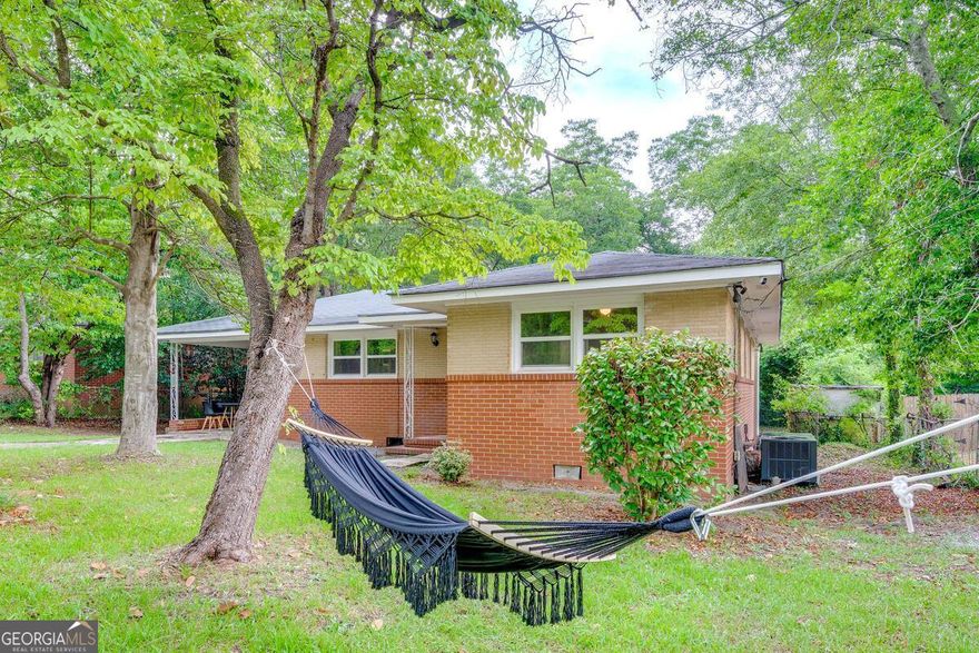 Welcome to this 3-bedroom, 1-bath full brick home in Warner Robins-ideal for a first-time buyer, investor, or Airbnb. The living area opens to the kitchen, with three comfortable bedrooms and a full bath down the hall. Recent upgrades include a renovated storage building, HVAC system under two years old, and a new water heater.    The home also comes with added features for the next owner: overhead ceiling fans with remotes, a stainless steel fridge, electric stove with oven, bookcase, new medicine cabinet, swing set, and hammock.    Step outside to enjoy the spacious, fenced backyard-private and perfect for relaxation or entertaining. The converted carport provides a versatile space for gatherings, while the large driveway offers parking for up to four vehicles.    This charming home is ready for its next chapter. Schedule your showing today!