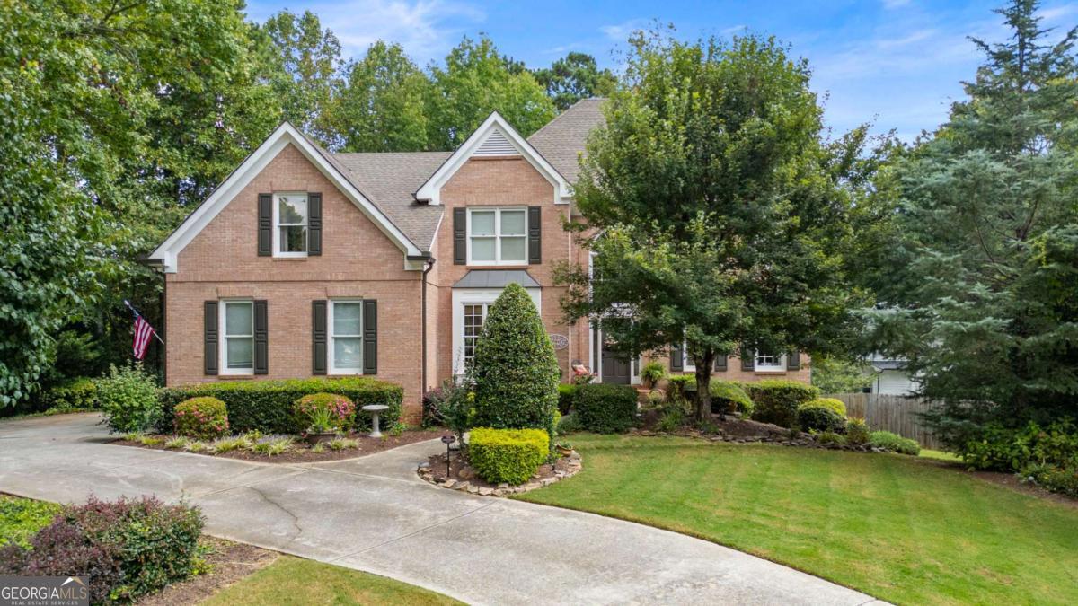 Nestled in Johns Creek-recently named the #1 Best Place to Live in the U.S. by U.S. News & World Report (2025-2026), this stunning traditional home offers the perfect combination of location, lifestyle, and luxury, with timeless curb appeal and thoughtfully designed spaces both inside and out. Offering a side-entry garage and a large, park-like backyard complete with a gazebo and firepit-ideal for outdoor entertaining. Inside, you'll find a high-end custom kitchen featuring a gorgeous stained island, designer granite, beautiful tile and high-end stainless appliances including a microwave drawer, electric cooktop, double ovens and refridgerator, plus a stained built-in bar with wine cooler. The kitchen opens seamlessly to the fireside family room and a light-filled sunroom. The main level also offers flexibility with a private office that functions as a true bedroom, thanks to its closet and adjacent full bathroom. Oversized dining room effortly flows into formal living room. Enjoy your mornings with coffee on the large covered back porch or fire up the grill on the spacious deck. The finished terrace level provides an entire additional living space, complete with a full kitchen, den, bedroom, bathroom, office, and a large recreation room that easily accommodates a pool table and more. Situated in Fulton County's #1 high school district, Northview, walking distance to the brand-new Cauley Creek Park and just minutes from the highly anticipated Medley development. The Huntington community is part of the highly desirable Shakerag neighborhood, residents enjoy exceptional amenities Olympic Size Pool, zero entry Kiddie Pool with water feature, 6 Tennis Courts, Full Basketball Court, Playground and Large Open Field. More photos coming soon!