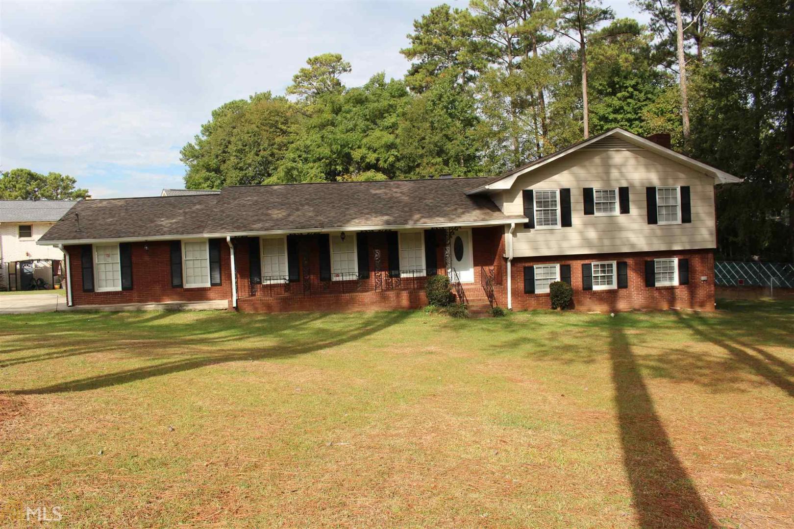 Spacious home in metro Atlantan suburbs. This house has a landscaped driveway and a two car garage that leads to a large kitchen with plenty of counter space. The dining room connects to the luxurious living area that has a wonderful mantle for a television above the faux fireplace. The sun room has a lead way to the backyards that is securely surrounded by a fence. The basement is quite large and also leads to the backyard. The side door on the opposite side of the living room has a convenient coat closet for storage. There are four bedrooms and a two newly renovated bathrooms.