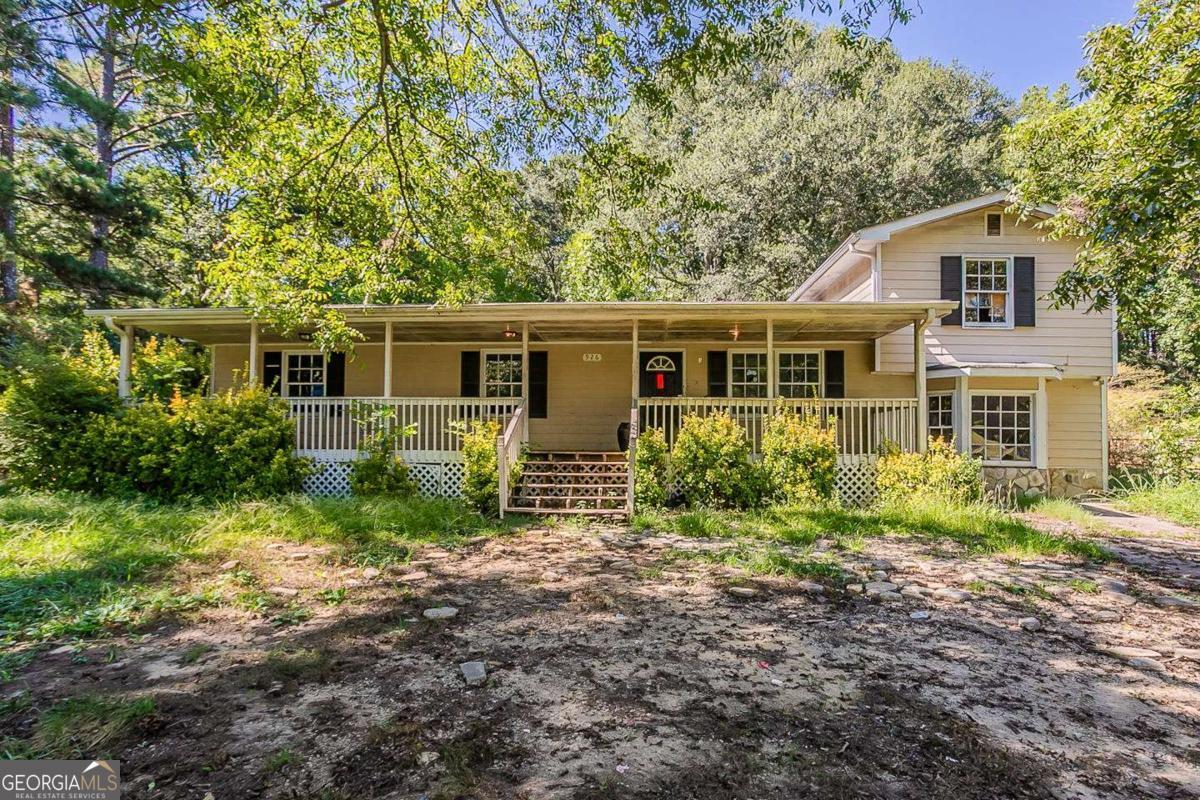 Opportunity knocks in Conyers! This 3-bedroom, 2-bath ranch offers 2,000+ square feet of living space and sits on a half-acre lot in a quiet, established neighborhood with no HOA. The home is in need of significant renovations and is priced accordingly - ideal for investors or experienced buyers looking to transform a home with strong bones. Features include a spacious layout, an eat-in kitchen with white cabinetry, and a separate laundry room. The large backyard offers room to reimagine outdoor living. With easy access to I-20, nearby schools, shopping, and parks, this is a prime value-add opportunity in Rockdale County.