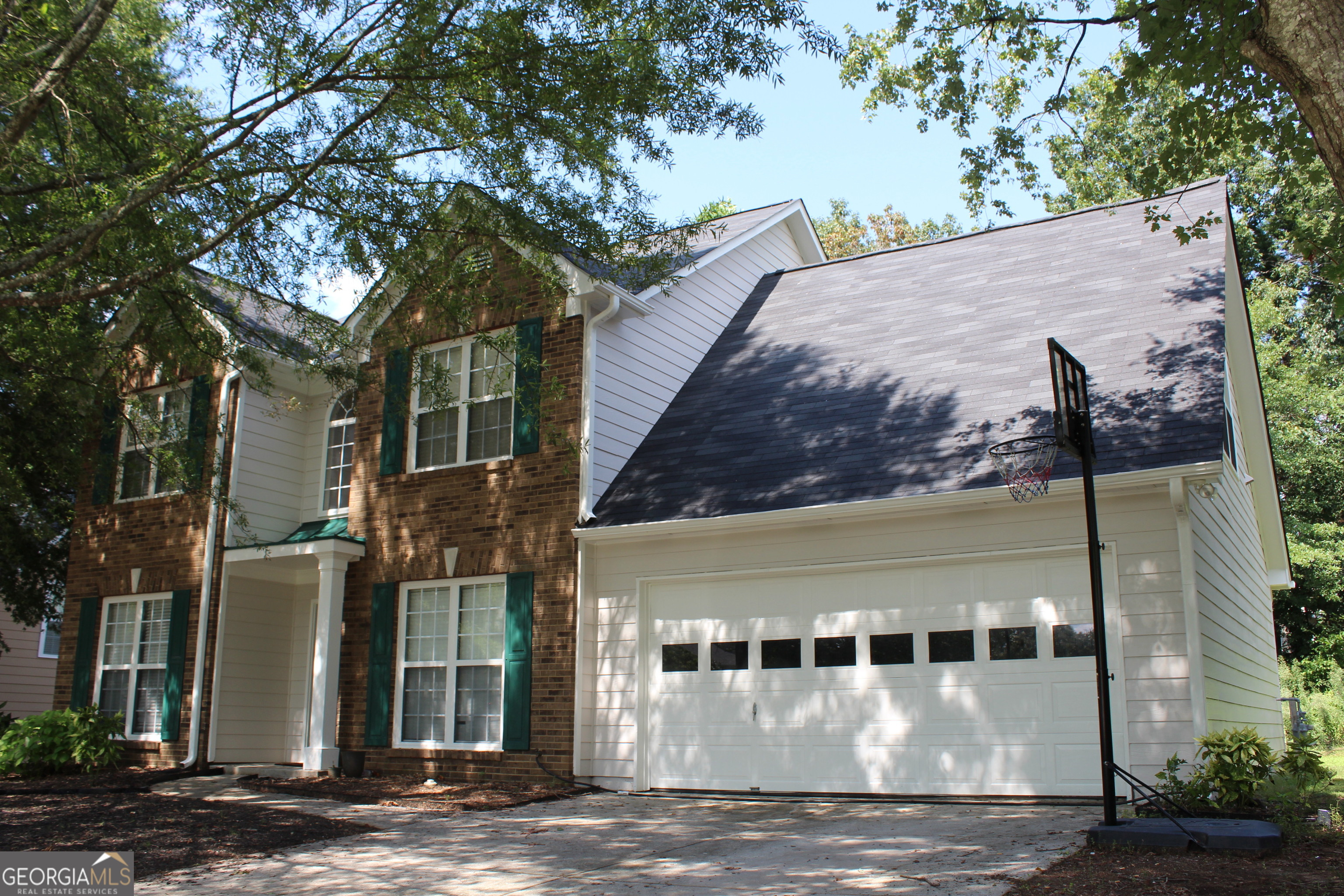 Welcome Home! Located in the wonderful neighborhood of North River Colony in a well-established community. This delightful home offers 4 bedrooms, 2.5 bathrooms, providing ample space for enjoyable living. The main floor features all newer carpet in family room, a separate formal living room and dining room. On the right side of the home, you will find a separate dining room that leads into a spacious kitchen with white cabinets, gas stove, and stainless-steel appliances. Open floor plan with large kitchen bar with view of breakfast room and family room with fireplace. The half bath on the right side of the kitchen area and a spacious laundry room. Upstairs features a large primary owner's suite with a spacious bathroom showcasing double vanities, a walk-in shower, large garden tub, and a walk-in closet. On the other side of the staircase, you will find two bedrooms, a full bathroom, and a generously sized bedroom down the hallway. Step outside to the patio, where you can unwind and enjoy the fresh air while overlooking the trees. With plenty of space for entertainment, play, garden or simply relax. Upgrades include new carpet in family room, exterior / interior painting, new roof and newer HVAC system. Award winning Gwinnett County Schools, conveniently located near grocery stores, local restaurants, community parks, shopping and the Mall of Georgia. This is a great opportunity to make this your dream home! Come today! This won't last long on the market!