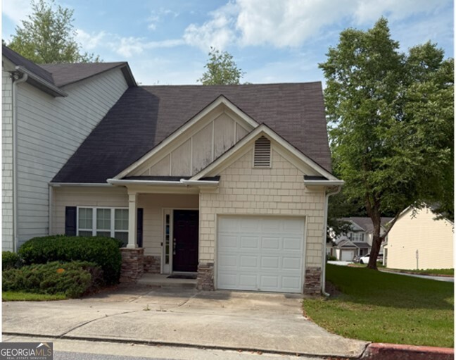 Welcome HOME to your spacious and move-in ready 3-bedroom, 2 1/2-bathroom townhome located in a well-maintained community just minutes from shopping, schools, and major highways! This beautiful townhome features fresh paint and luxury vinyl flooring, creating a clean and inviting atmosphere. The main level boasts a bright, open living room, perfect for entertaining or relaxing with family. The Owner's suite is also located on the main level featuring ample closet space and bath with soaking tub and separate shower. Upstairs Two additional secondary bedrooms provide plenty of room for family, guests, or a home office, along with a full hall bathroom for convenience. Don't miss your chance to live in this charming property in Lithonia! Minimum lease term 1 year. Resident pays all utilities-electric, water, cable, alarm.