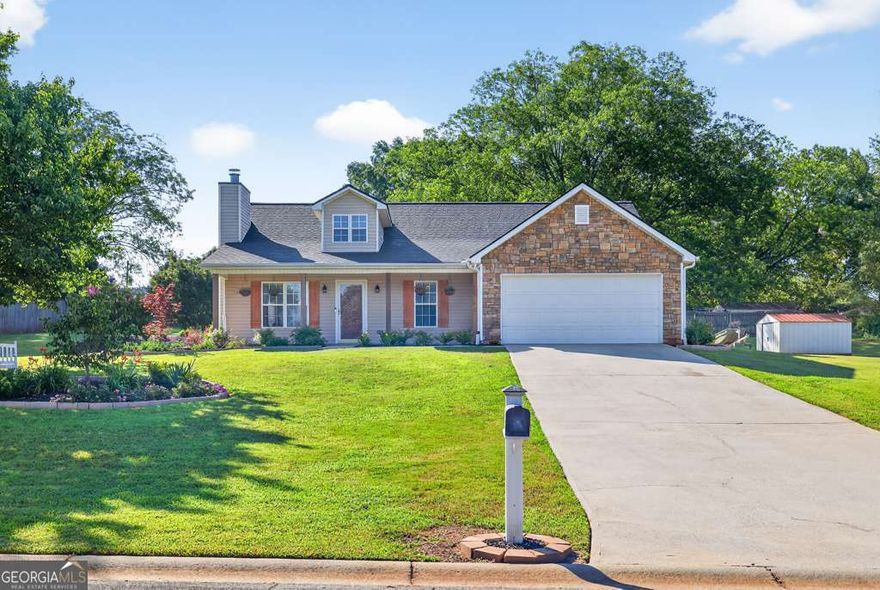 Beautifully Upgraded Ranch on Landscaped Lot with No HOA! Bright Family Room with wood-burning fireplace, opens to Dining Area. Completely remodeled Kitchen: NEW soft-close cabinets, NEW granite countertops, NEW subway tile backsplash, NEW stainless steel appliances, and NEW recessed lighting! Additional cabinets added for storage and coffee bar! Primary Suite boasts trey ceilings, large walk-in closet, lots of natural light, and Ensuite Bath with dual vanity. Two generous Secondary Bedrooms share Full Bath with new vanity cabinet & granite countertop. Outside, enjoy the covered patio overlooking the spacious, landscaped back yard with storage shed! NEW ROOF & UPGRADED FLOORING! Kitchen Refrigerator, Clothes Washer, and Clothes Dryer remain! Enjoy the freedom of no HOA, yet the convenience of a Winder location with easy drive to 85 or 316, plus all of the shops and dining of Winder, Hoschton, and Braselton nearby!