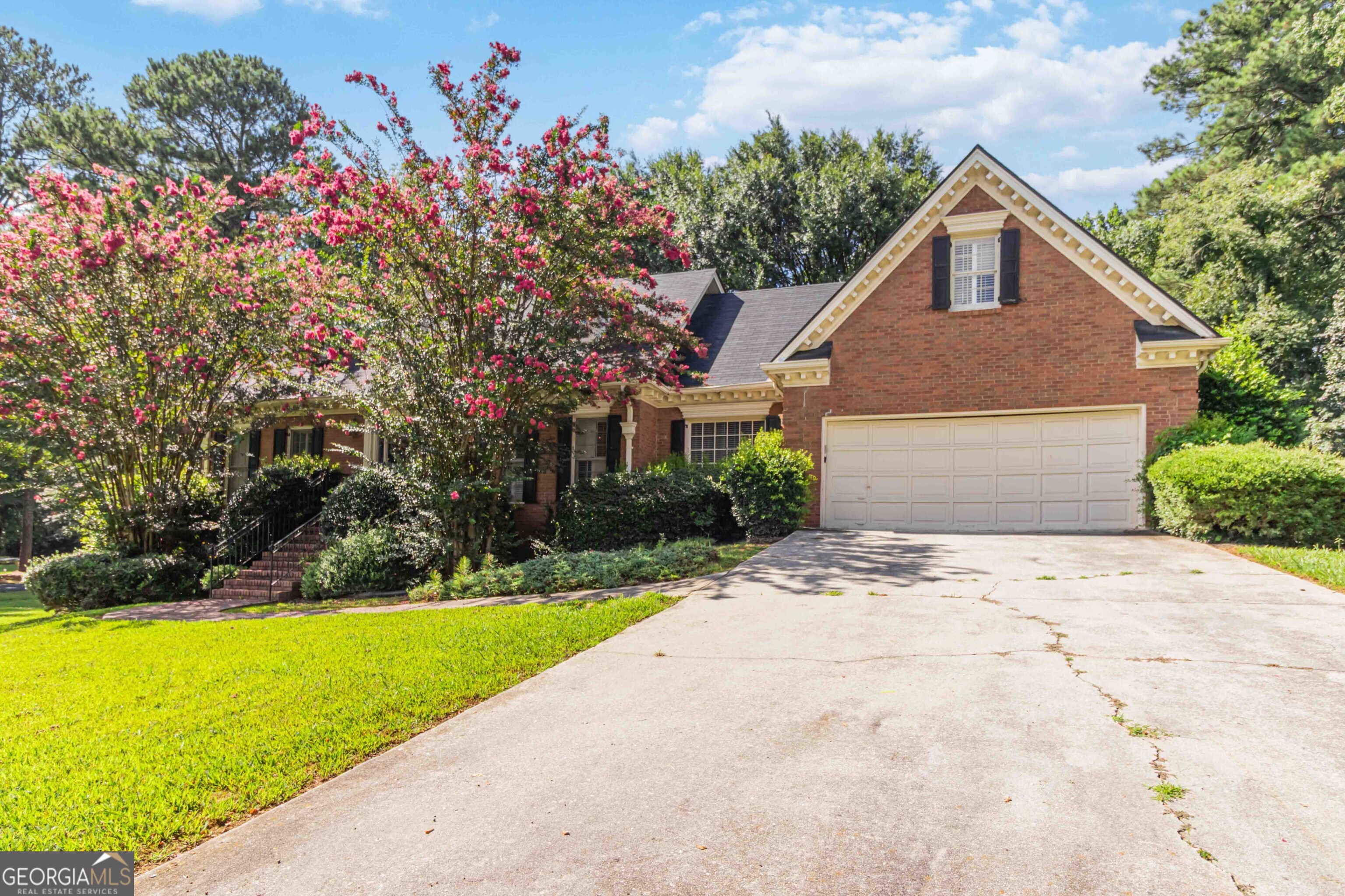 Spacious 4BR/2.5BA Home with lots of room in Stone Mountain! Don't miss this opportunity to own a well-built 4-bedroom, 2.5-bath home ideally situated in Stone Mountain, just 4.9 miles from the renowned Stone Mountain Park. This property offers great bones and functional features ready for your personal touch. Inside, enjoy the warmth of hardwood floors on the main level, a bright kitchen with white cabinetry, and a primary suite conveniently located on the main floor. You'll find a rare boat garage converted to an exercise area. Convert back to storage. Easy Access to Stone Mountain Freeway Close to Shopping, Dining & Entertainment. With a solid structure and a highly desirable location, bring your vision and handyman skills to make this home shine again.