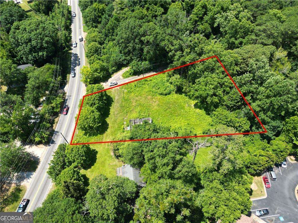 ATTENTION BUILDERS AND INVESTORS! Seize the chance to develop a custom home on this sprawling nearly 1-acre lot at 2789 Jonesboro Rd. Priced at $69,000 and available as-is, this site boasts a pre-completed structural foundation, setting the stage for rapid development. With a potential after repair value exceeding $400,000, this property is a lucrative opportunity. Located merely 5 minutes from Interstate 75 and 10 minutes from Downtown, Midtown, and the Airport, this prime parcel offers the perfect blend of seclusion and convenience, ensuring easy access to top amenities and major transport routes for effortless commuting. The lot is level with minimal clearing needed, and comes equipped with essential utilities like electricity, gas, and water. Take advantage of this exceptional opportunity to craft your dream residence or capitalize on profitable AirBNB ventures with no HOA constraints.