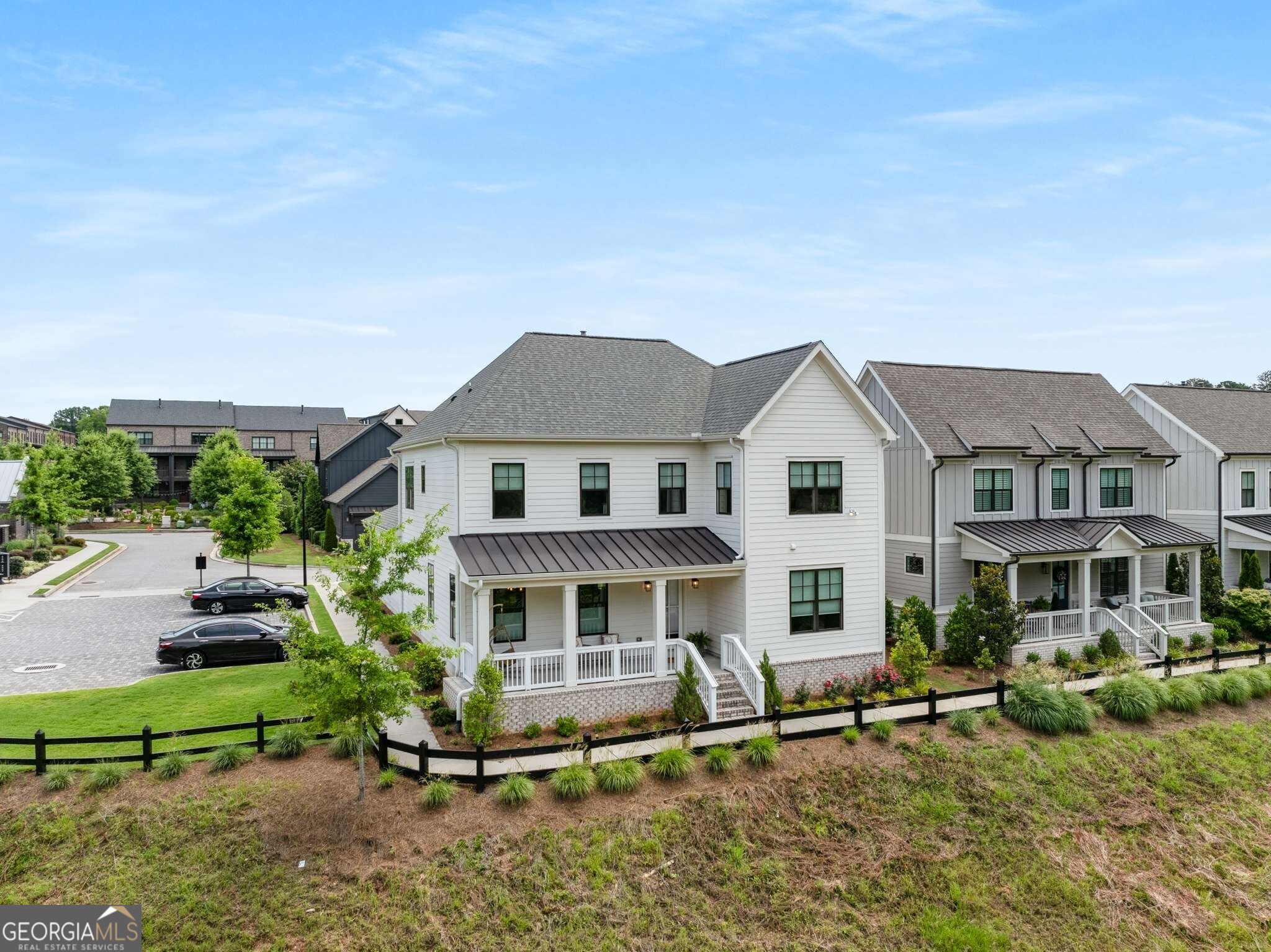 $20,000 towards buyer's closing costs! Experience exceptional low maintenance luxury living at Halcyon in Alpharetta designed for the ultimate live, work and play lifestyle. Nestled in the heart of one of the area's most desirable communities, this modern contemporary home offers the perfect blend of convenience and charm. As you enter, you are welcomed by a covered front porch, expansive ceilings and an abundance of windows and natural light. Offering both privacy and comfort, this home features a full bedroom and bath on the main level, engineered hardwoods and tastefully chosen custom features. The open-concept floor plan flows effortlessly between the living, dining, and outdoor spaces, while the living room itself becomes a focal point with custom tiled fireplace. The chef's kitchen features an oversized quartz eat-in island, stunning stainless-steel appliances and walk-in pantry. Upstairs, the primary suite is a true sanctuary featuring a spa-like ensuite bath with glass enclosed shower, double vanities and a walk-in closet. The upper level also features two additional bedrooms with jack and jill bath, an open loft area and a conveniently located laundry room. This residence is thoughtfully integrated into its surroundings, providing a serene retreat with convenient access to a curated selection of restaurants, retail, and entertainment-all just moments from your doorstep. Take advantage of the neighborhood pool, clubhouse, green space and direct access to the Big Creek Greenway. Enjoy the vibrant Alpharetta location close to downtown Alpharetta and the Avalon, and convenient proximity to GA400 for navigating around town with ease.