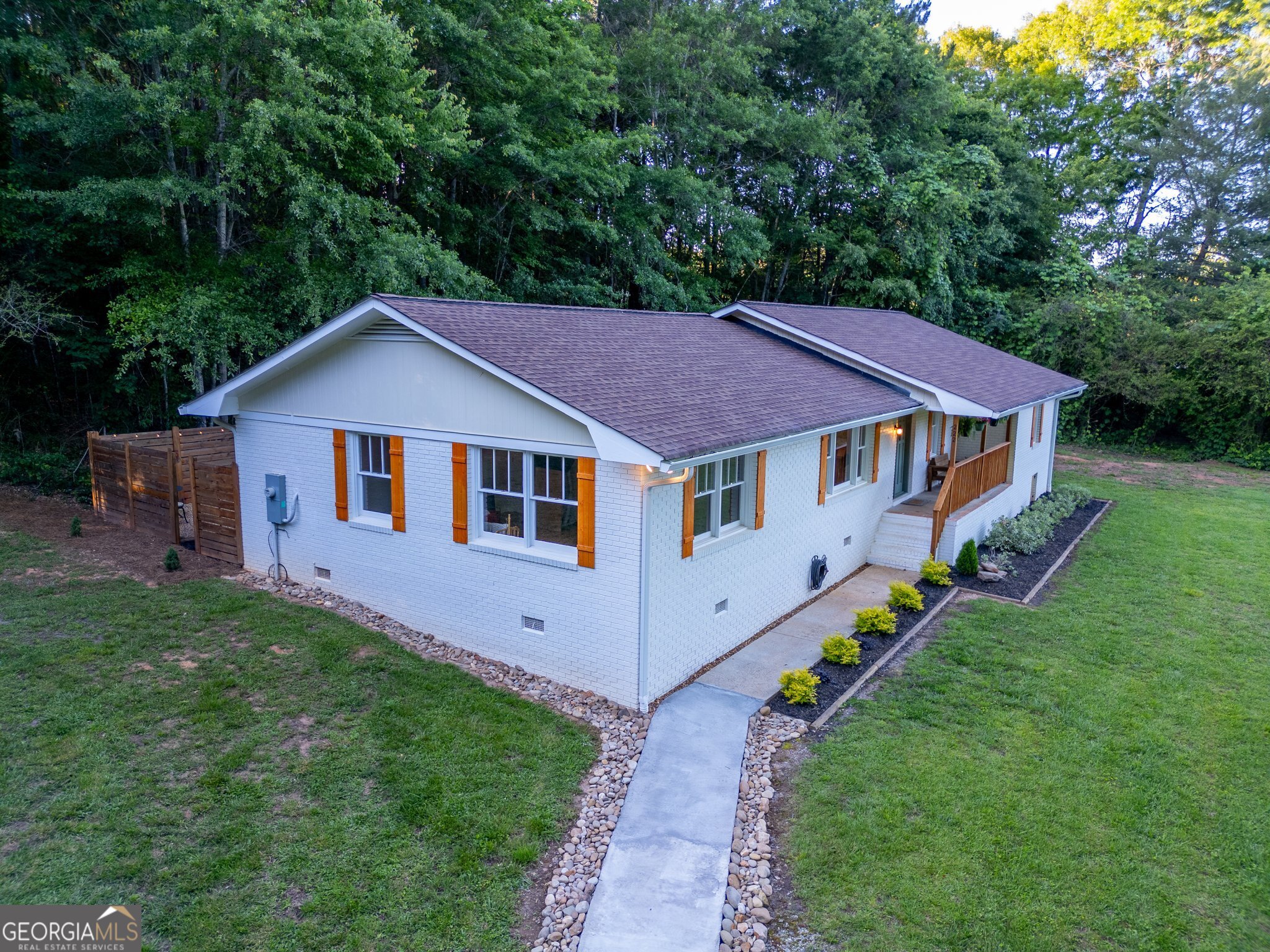 This property is located down a gravel road that is approximately 0.25 miles long! Welcome to this charming 4-sided brick ranch nestled on 6.79 acres in the heart of Mount Airy. This recently renovated home offers the perfect blend of privacy, space, and convenience. A peaceful creek runs through the property. Inside, you'll find a versatile bonus room that can serve as an office, sunroom, or entertainment space-ideal for today's flexible lifestyle. Enjoy the benefits of a large, private parcel while still being just minutes from downtown Clarkesville and Cornelia. You're close to local shopping, dining, and vibrant community events. With quick access to Highway 365, commuting is easy, all while enjoying the quiet comfort of the countryside. You're near everything Habersham County has to offer, including top-rated schools and outdoor recreation.