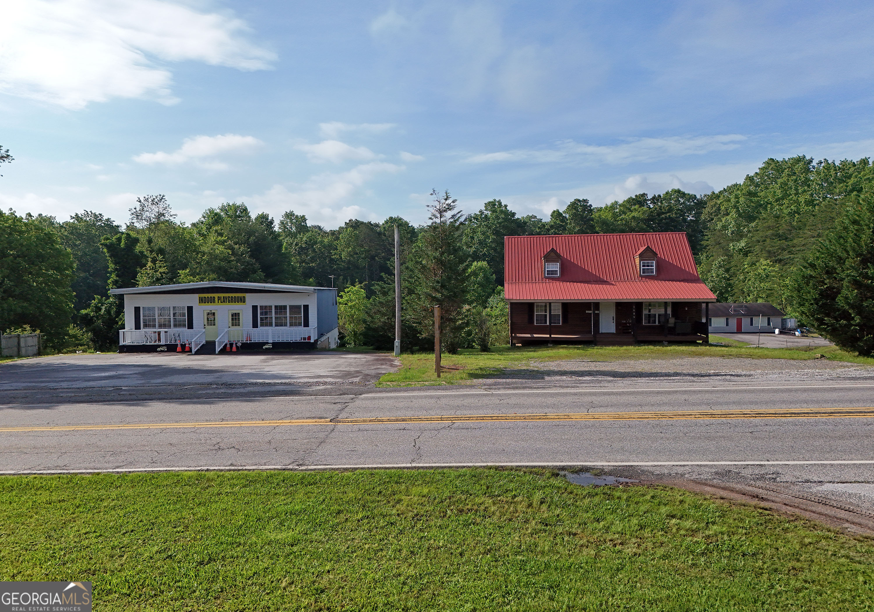 PRIME INCOME-PRODUCING OPPORTUNITY ON BUSY MAIN ROAD IN BLAIRSVILLE! Two Buildings both Leased/Rental History. This 1 Acre Commercial Property features a 4,000 sq ft warehouse with circular driveway that goes around both buildings to Garage access, half currently leased for steady rental income. Main level with 1/2 bath and unfinished Basement area with full bath and 2 Garage Doors. A separate additional 1,640 sq ft 3 bedroom, 2 1/2 bath tenant occupied home, and basement garage with 1,080 sq ft, offering an additional revenue stream. Both structures include spacious basements with untapped potential for upgrades or expanded use. Large Parking Area for both buildings. New Septic. Ideal for Investors, Business Owners, or those seeking versatile, high visibility Property with built in cash flow and room to grow.
