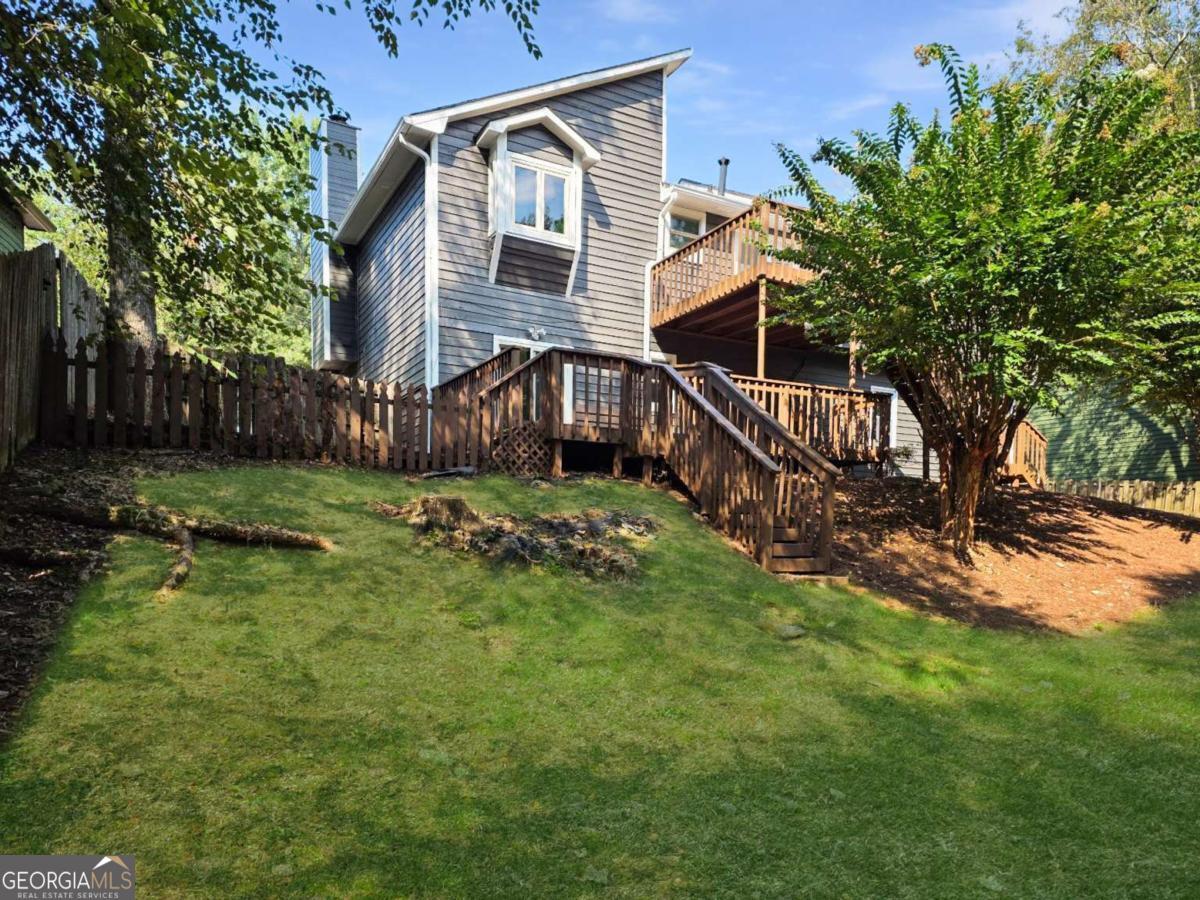 Welcome home to this beautifully updated 4-bedroom, 3-bath home with a 2-car garage. Tucked against a picturesque stream, this property offers a peaceful natural backdrop right in your backyard. Inside, you'll find a spacious, light-filled layout featuring a bright kitchen with white cabinetry and a convenient pass-through for easy entertaining. Gather in the inviting Great Room, complete with a cozy fireplace after a long day. Spacious master bedroom with WIC w/custom built ins. Master bath features a custom vanity with dual sinks. Retreat to the finished lower level with its private bedroom, full bath, and two versatile bonus rooms-ideal for guests, a home office, or hobbies. Step outside to a 2-tier deck that offers plenty of space for grilling, dining, and soaking up the outdoors. Equipped with a Generac solar panel system for energy efficiency and peace of mind. Stylish, comfortable, and move-in ready, this home truly has it all! Close to restaurants and shopping.