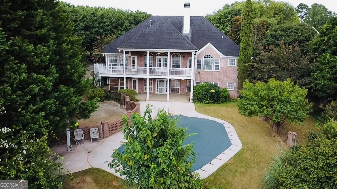 *Rare Opportunity!!! This immaculate 4-sided brick estate offers the unique advantage of two completely separate homes, creating an ideal setup for multi-generational living or for maximizing rental income. The main floor features gleaming hardwoods and tile, while the basement includes a mix of hardwood, tile and carpet. (A carpet allowance will be given.) Each self-contained floor includes an owner's suite, full kitchen, laundry room, and garage. With three bedrooms, 2 full bathrooms, (additional 1/2 bath on main) and outdoor spaces on each floor, the possibilities are endless! Relax and entertain on the expansive back porch or patio, enjoying the serene views of the in-ground pool and natural beauty surrounding you. You'll have the benefit of living in a gorgeous neighborhood with no HOA. Don't miss the chance to explore all that this exceptional property has to offer!