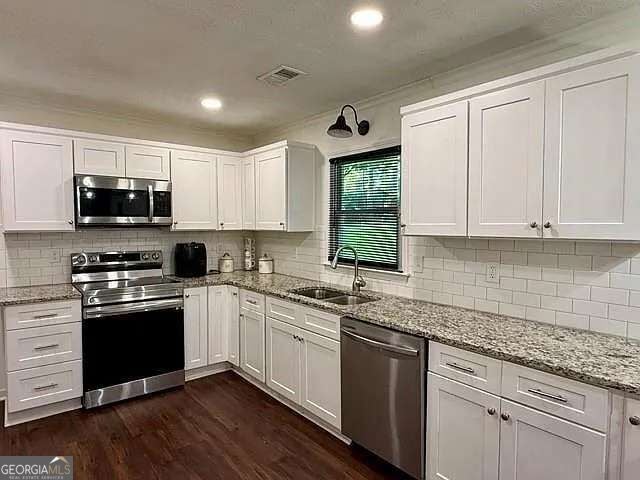 Photo of 201 Lockring Drive SW, Lilburn, GA 30047 (MLS # 10870647)
