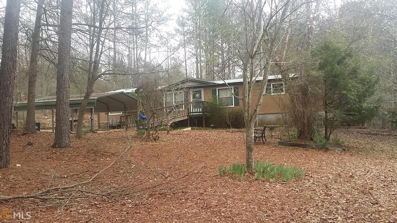 very private country retreat. less than mile from WMA, Archery range, shotgun range, target range, lakes, conservatory, camping, walking trails. needs someone to move and love it and make it your own. 6.7 acres mostly wooded. Washer/dryer included. cover parking.