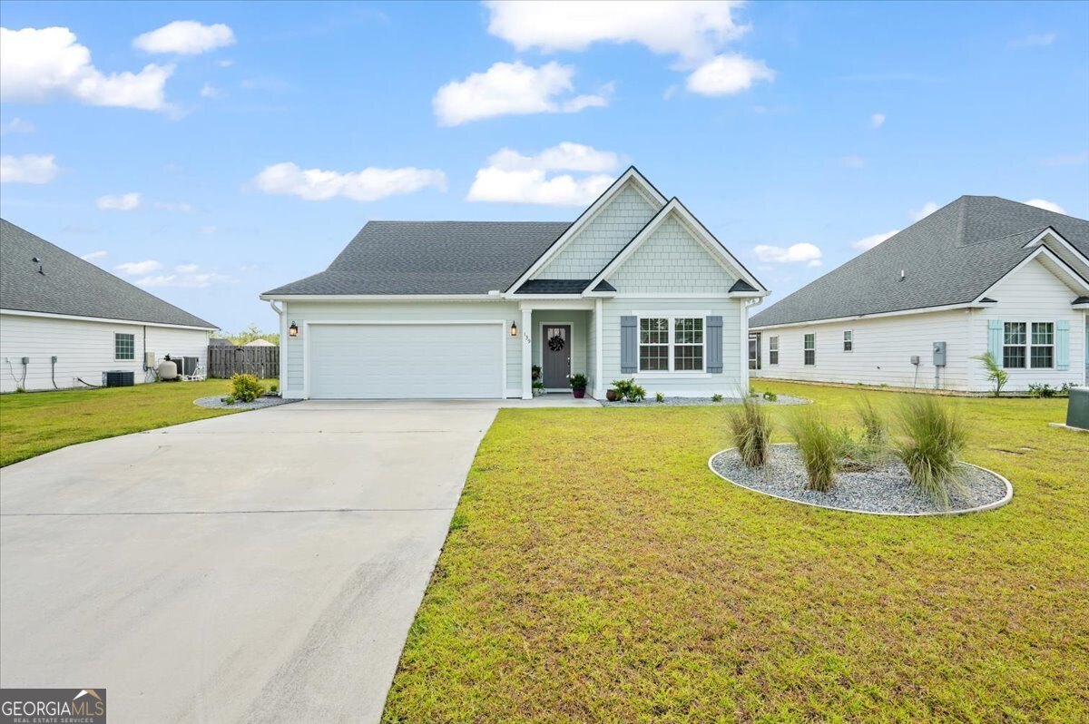 Welcome to 139 Allie Loop in Brunswick, GA. This impeccably maintained home offers 1,777 square feet of comfortable, move-in ready living space with beautiful lake views. Featuring 3 bedrooms and 2 bathrooms, the home is thoughtfully designed with a functional layout and stylish, low-maintenance finishes throughout. Step inside to a spacious, open-concept living area filled with natural light. The living room flows seamlessly into the dining area and kitchen, creating a perfect space for everyday living and entertaining. The kitchen includes stainless steel appliances, plenty of counter space, and abundant cabinetry, making it both practical and inviting. There is no carpet in the home-luxury vinyl plank flooring extends throughout every room for a clean, modern look and easy upkeep. The generously sized primary suite features a private bathroom with double vanities and a large walk-in closet that conveniently connects to the laundry room. The additional two bedrooms offer plenty of space for guests or a home office. Enjoy the outdoors from the screened-in back porch, which overlooks the west end of the lake. With no rear neighbors and a tranquil water view, this is the perfect spot to relax and unwind. The backyard offers both privacy and scenic beauty rarely found in similar properties.