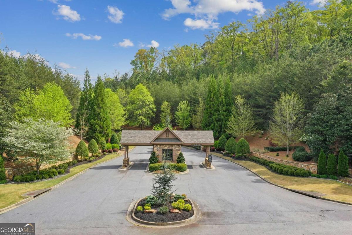 Experience luxury living at its finest in this prestigious golfing community nestled in Alpharetta but located in Cherokee County, Georgia. Welcome to Echelon Golf Club, where exclusivity meets elegance. Located just moments from Milton, enjoy the best of both worlds with access to top-tier amenities and lower property taxes. Situated within this semi-private golf community lies a prime 1.44-acre lot boasting unparalleled views and unparalleled potential. Backing up to the picturesque par 3 hole #3, framed by the serene waters of Byron Lake, this lot offers the perfect backdrop for your dream home. Immerse yourself in the natural splendor of the community, surrounded by mature hardwood trees that epitomize southern charm. Designed by renowned architect Rees Jones, the 18-hole championship golf course has garnered acclaim from Golf Digest, ranking among the top courses in Georgia. Embrace the art of refinement at the 32-acre practice and training facility, perfecting your swing amidst lush surroundings. For tennis enthusiasts, lighted courts await, providing ample opportunity for friendly matches under the stars. After a day of recreation, retreat to the clubhouse, where delectable dining options await in a sophisticated setting. With the freedom to bring your own SKILLFUL builder and customize your home to perfection, seize the opportunity to create the ultimate sanctuary in this exclusive enclave. With its ideal layout for a basement construction, this lot beckons those seeking a harmonious blend of luxury and lifestyle. Live your legacy at Echelon Golf Club.