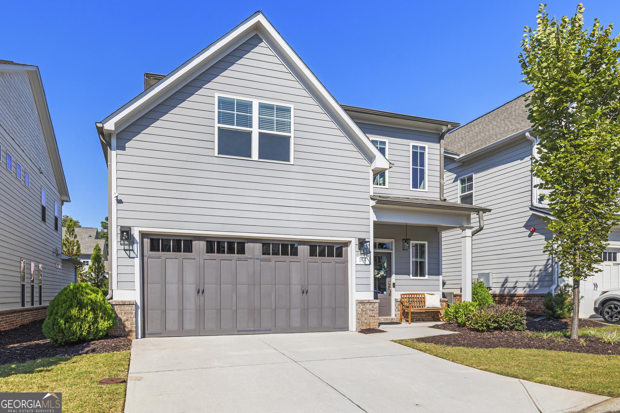 Welcome to Promenade at the Square! Just steps from vibrant Marietta Square, 514 Coral Street is an amazing homes in this sought-after community. Built in 2019, this residence offers breathtaking Kennesaw Mountain views and convenient access to City Club Marietta Golf Course. The bright, open-concept main level features a welcoming foyer, formal dining room, modern kitchen, spacious living area, powder room, and a luxurious primary suite with a beautifully designed bath and generous closet space. Upstairs, find three spacious bedrooms, one with an en-suite bath, plus another double-vanity bathroom and a versatile loft perfect for a home office, playroom, or relaxation space. Ample storage includes a spacious attic and abundant closets throughout. As part of the early section of the neighborhood, enjoy access to the community pool across the street from this home, with yard maintenance included in the affordably-priced HOA. Don't miss this exceptional home in a premier location! The home has been upgraded with hardwood flooring all through out the home and update modern fixtures! Garage has added overhead storage racks installed for extra storage! The Listing Agent resides in the neighborhood, has been here since the start of construction, and is the most knowledgeable about the community-reach out with any questions!