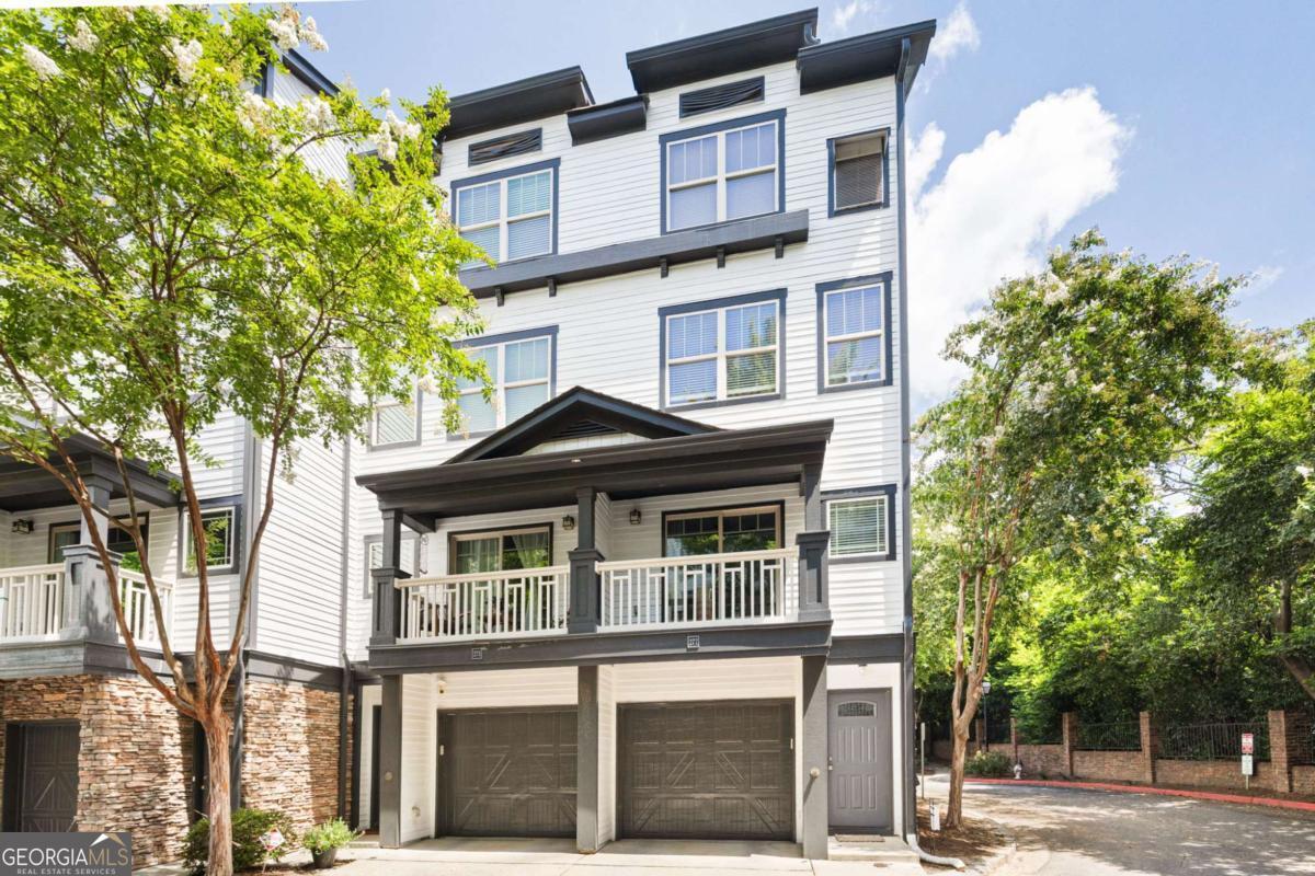Welcome to this upscale townhome perfectly positioned between Buckhead and Midtown and close to Atlanta's dynamic Beltline. Designed with comfort and style in mind, this home features gleaming hardwood floors, a spacious loft ideal for a home office or bonus space overlooking the primary suite, and a modern kitchen with stainless steel appliances and stained wood cabinetry. The updated primary bath offers a serene, spa-like retreat. Enjoy the convenience of a private garage along with guest parking within the community. Amenities include tennis courts, a dog run, and low HOA fees that cover water, sewer, roof, and exterior maintenance. Located near parks, local eateries, and other attractions-with quick access to I-75, I-85, and GA-400-this home offers the best of city living in a prime Atlanta location.