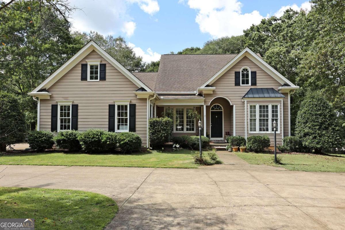 3+/- gorgeous Alpharetta acres with low Cherokee taxes and excellent schools! Bring your horses or car collection! Detached workshop/garage, RV hookup & dump, prewired for a generator. High speed business internet. Beautiful pasture & gardens, nothing missed! This one story home features a total of 5 bedroom suites, eat-in kitchen open to the breakfast room. Separate formal dining room and fireside great room. 2-car attached garage has easy access to the kitchen. Lower level has a full bedroom & bath, family room and storage. Property is gated and fenced. Use Google maps, not Apple maps for GPS. Huge Fenced with water sprinkler installed farm area. Gas cook top installed in 2023. New refrigerator, washer dryer unit installed in 2023. Newly furnished guest room, hall and buffet area in the basement.