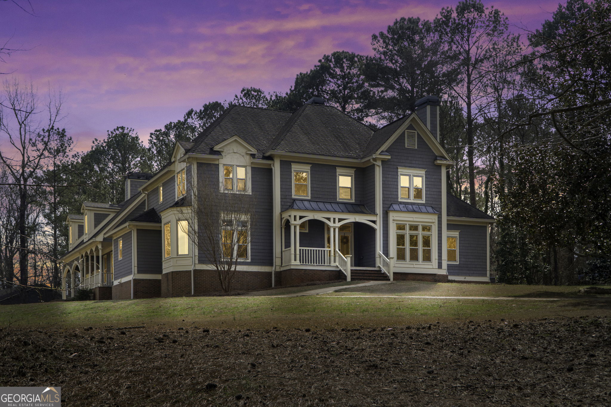 Introducing an ICONIC MCDONOUGH ESTATE, it's a one of a kind Better Homes & Gardens floorplan featuring almost 5,000 stately square feet on 2.62 acres in McDonough. A rare opportunity to experience this luxurious living space boasting 4 bedrooms, 3.5 baths with so much room to grow with an additional 3,200 sq ft detached 12-car garage/workshop on the back of the property perfect for the car enthusiast along with an additional 600 sq ft unfinished Bonus Room above the attached 2-car garage with separate exterior stair entry, that would be great for a teen suite, in-law suite, or roommate. As you arrive on the property and drive up the long private driveway, you will be impressed by the large, picturesque grounds and the detail of the vast architectural design. Walk into the two-story foyer where you are met with gorgeous hardwood floors throughout with an executive Library/Study complete with a fireplace, built in bookshelves and the sophistication that you would expect. The Master on the Main features gorgeous natural light with floor to ceiling windows, French doors to the back yard and another cozy fireplace. The Master suite includes a massive ensuite Bathroom with huge double vanities, stand up tile shower, separate soaking tub, separate water closet, and large walk-in closet. On the main floor there is also a half bath with storage closet. Continuing through the main level you will find an elegant fireside living room with additional built in bookshelves with an open concept up to the second story catwalk and gorgeous staircase. Off the living room is the Huge Formal Dining Room fit for royalty with picture windows throughout. As you head towards the large kitchen there is a separate wet bar area perfect for entertaining along with the massive island as the centerpiece of the kitchen, with endless storage complete with Double wall Ovens, Walk-in Pantry, built in desk, and a separate Breakfast area overlooking the backyard, perfect for a Pool. There is an additional Family room that features 1 of 4 fireplaces in the home and doors that go out to the front and back porch. On this side of the house is the side entry where you will find the large Laundry Room/Mud room equipped with a utility sink hook up. The second staircase will lead you to the west wing of the home Upstairs where there is a perfect flex space for an additional office or playroom, there are 3 additional bedrooms, every bedroom has its own Walk-in closet, in addition each room has its own individual vanity that connect to the 2 Jack and Jill bathrooms. One of the upstairs bedrooms features a large finished Bonus room attached to the walk-in-closet. The possibilities are endless in this home, with unlimited flex space for storage, a theater room, home gym, office, workshop, game room, craft room, studio or anything you desire!! All 55 windows have been replaced with NEW double pain Energy Efficient argon glass throughout the house. One mile to Interstate I-75 and nestled near soccer parks, dog parks, walking trails, playgrounds, golf courses, shopping, restaurants, top schools, cinemas, and the historic McDonough Square all within 3 miles or less, this property offers a perfect blend of distinguished serenity and convenience. Explore the possibilities of calling this one-of-a-kind place, HOME!! Schedule a Private Showing Today with Kristi at HomeSmart Realty 404-285-1248. This one won't last long!!