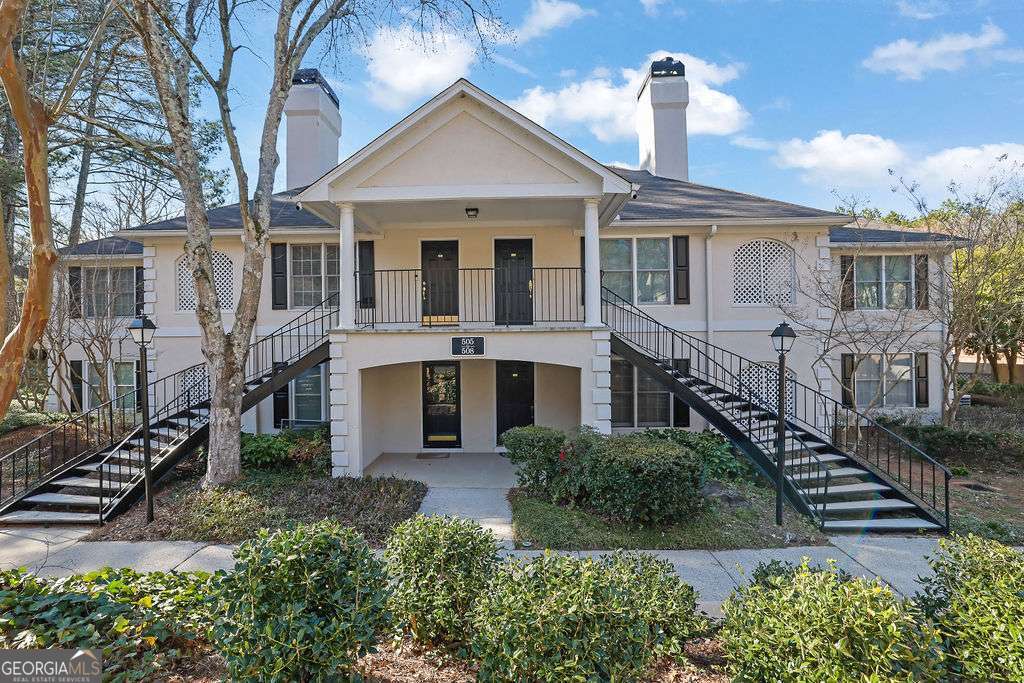 Welcome to this beautifully maintained, move-in ready single-level condo offering 2 spacious bedrooms and 2 full bathrooms-Perfectly situated just minutes from The Forum and Historic Norcross-and only a short stroll to Life Time Athletic Club and Triangle Park-this home offers the best of convenience and serenity, tucked away in a peaceful, wooded enclave that feels like a private retreat. Inside, you're welcomed by a bright, open foyer that flows into a large living room with fireplace, which effortlessly extends into a screened in porch with tranquil views of lush, established greenery. The neutral white and gray palette throughout complements the sleek stainless steel appliances and durable stone countertops in the kitchen. A generous dining area and plentiful cabinet and counter space make this home perfect for everyday living or entertaining. The separate laundry room just off the kitchen adds extra convenience.The primary suite boasts a large walk-in closet and a private en suite with dual vanities and a tub/shower combo. The second full bath features a tub/shower combo, perfect for guests or a roommate setup. Located in Peachtree Forest Plantation, a serene and well-kept community of just 80 units, residents enjoy amenities like a pool, well-lit walkways, ample guest parking, and meticulously landscaped grounds. HOA dues include water, trash, and exterior maintenance. Love to explore? Historic Norcross is just 3 miles away, and several parks offering walking trails, access to the Chattahoochee River, and ball fields are all within 4 miles of your new home. When you're ready for shopping or dining out, Peachtree Corners Town Center and The Forum are just around the corner