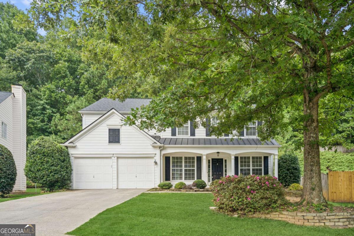 Nestled on a quiet cul-de-sac in The Glen section of coveted Woodlands neighborhood, this gorgeous traditional is the perfect blend of timeless elegance and modern living! A hidden coat closet disguised as an unassuming bookcase is the first surprise of beautiful woodworking detail throughout. Thoughtfully designed and freshly painted, the home features separate formal living and dining rooms, plus dedicated home office with custom built-in bookshelves and desk, recessed lighting, and coffered ceiling. An inviting family room with vaulted ceiling and striking built-in centers around a stunning stone fireplace and flows seamlessly into the eat-in kitchen. Lovely updated granite and stainless chef's kitchen is complete with an island, cozy breakfast nook, and walk-in pantry perfect for daily living and entertaining. Brand new carpet upstairs - including generous primary suite offering dual vanities, a soaking tub, separate shower, and large walk-in closet. Secondary bedrooms are spacious, including one with custom built-in window seat and share a charming full bath with dual sinks and a tub/shower combo. Step outside to a private backyard retreat featuring a stone patio and pergola, ideal for barbecues or relaxing and enjoying nature. Incredible community amenities include a clubhouse, pools, tennis courts, and walking trails, offering an active, connected lifestyle in an awesome location with great schools and more! Bonus: Qualified buyers may be eligible for discounted rate options and no-lender-fee future refinancing.