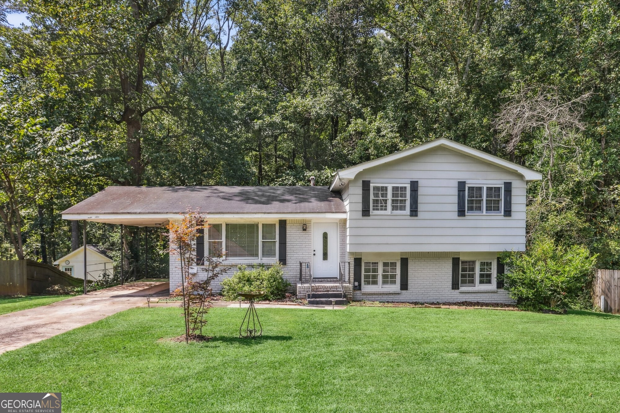Totally renovated 3 bed, 3 bath home in East Atlanta with an open floor plan and stylish modern finishes. Features include hardwood floors, updated kitchen with white cabinetry, stainless steel appliances, and a sunny eat-in area that flows into the living space. The finished lower level offers a flex space, bedroom, and full bath-perfect for guests or a home office. Enjoy a large private yard ideal for entertaining, gardening, or play. Move-in ready and minutes from East Atlanta Village dining, shopping, and nightlife!
