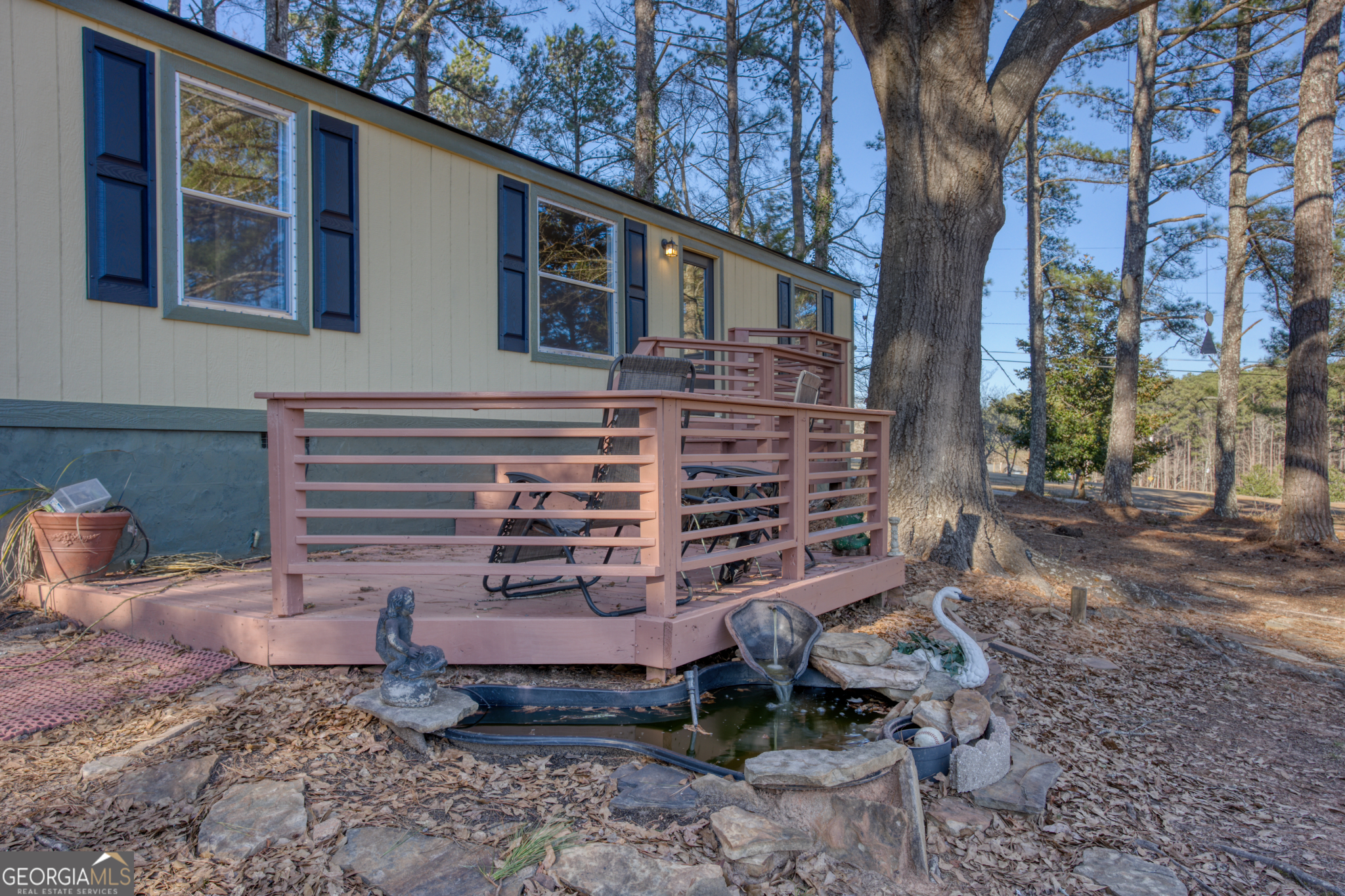 This is a 3BR/ 2Bath modular home on over 3 acres in a very private community. This home has been completely renovated from top to bottom. The lot is open with a very large work shed in rear of the lot. The shed has electricity and water. The home has a playground and treehouse if needed for kids. This home shows very nice and is a must see....