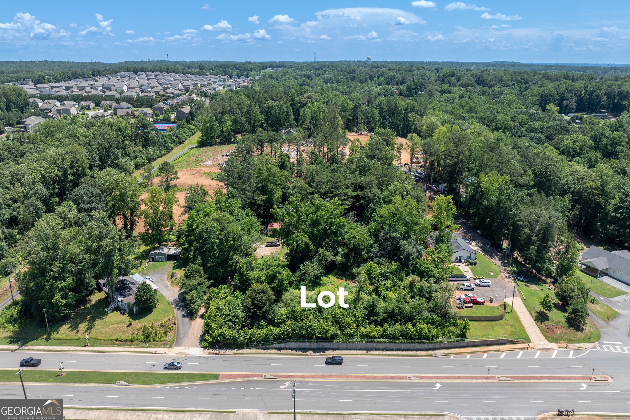PRIME location near downtown Cumming just a couple of miles off the square. Great opportunity for new owner with endless possibilities. Property fronts Castleberry Road. High visibility just down the street from the Cumming Fairgrounds, Forsyth County Board of Education and George W. Whitlow Elementary School. Sewer connection is available. Property is an estate sale. Shared driveway. Old well house still remains but old family home has already been removed for buyer's convenience.
