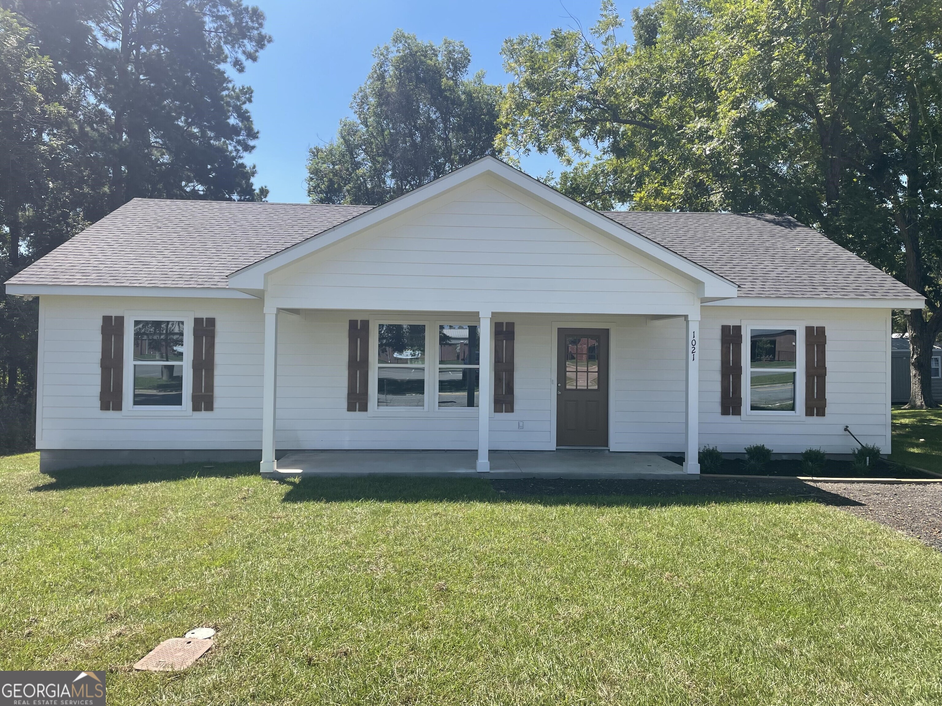 Welcome to this charming well built new home at 1021 11th Ave NW in Moultrie, GA. Conveniently located near local amenities, this home is a wonderful opportunity for anyone seeking a cozy and inviting space. Beautiful features include a vaulted ceiling, open floor plan which includes living, dining, and kitchen. All kitchen and bath cabinets equipped with quartz countertops and under mount sinks. It has a spacious master suite with walk in closet. The utility room includes a washer and dryer and a nice pantry area complete with shelving. It also includes a fenced in back yard with an 8' double gate for easy access. Porches include tongue and groove wood ceilings with a nice welcoming feel.