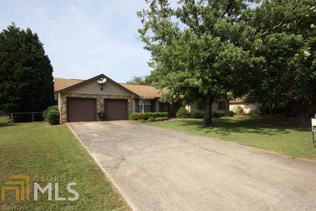 Great space, inside and out. Large living area with electric fireplace and barn board, some interior rooms painted 7/2015, 3 bedrooms, 2 baths, dining area with bay window, kitchen cabinets replaced in 2006, laminate and tile flooring only 1 bedroom with carpet. Large covered back patio, almost a 1/2 acre lot, large fenced backyard, workshop with power and water. New roof April, 2016
