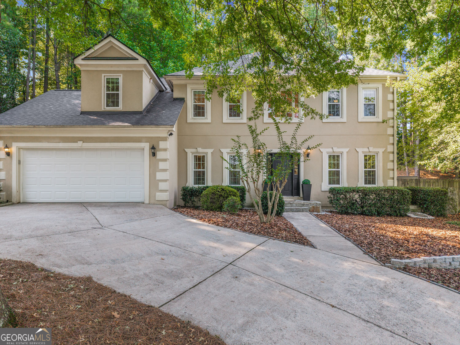Do not miss your chance to claim a home that truly has it all! This beautifully renovated retreat blends everyday comfort with entertaining elegance. From the moment you step inside, you're welcomed by wide-open spaces, gleaming hardwoods, and upgraded lighting that set the stage for what's to come. Flanking the foyer are two versatile rooms. Currently styled as a formal sitting area the original dining room connects directly to the kitchen, while the bonus front room invites endless possibilities. Think home office, playroom, or transform it into that cozy study or swanky bar you've always dreamed of. The main living area is open-concept perfection. Built-in bookcases add character and display space, while the living room flows seamlessly into casual dining and the expansive kitchen. Here you'll find endless counter and cabinet space, high-end appliances, and plenty of room to gather, cook, and connect. Upstairs, the primary suite shines with a spa-like renovated bath and a generous walk-in closet. Three additional bedrooms and another full bath provide comfortable quarters for family and guests. The basement is the true jackpot complete with an additional bedroom and bath, a home gym, and a large rec space ideal for movie nights, game days, or weekend visitors who'll appreciate their own private retreat. Outside, the party continues with a spacious deck and charming gazebo, perfect for dinner under the stars, cocktail hour with friends, or simply winding down in the fresh Georgia air. All of this is nestled in Georgian Ridge, a quiet community with easy access to top schools (including the new Primrose School), Newtown Park, shopping, and GA-400. Optional swim/tennis memberships are available at nearby Hartridge ($600/year; tennis-only memberships also offered). This one checks every box, comfort, convenience, and character in all the right places. Call to book your private tour today!