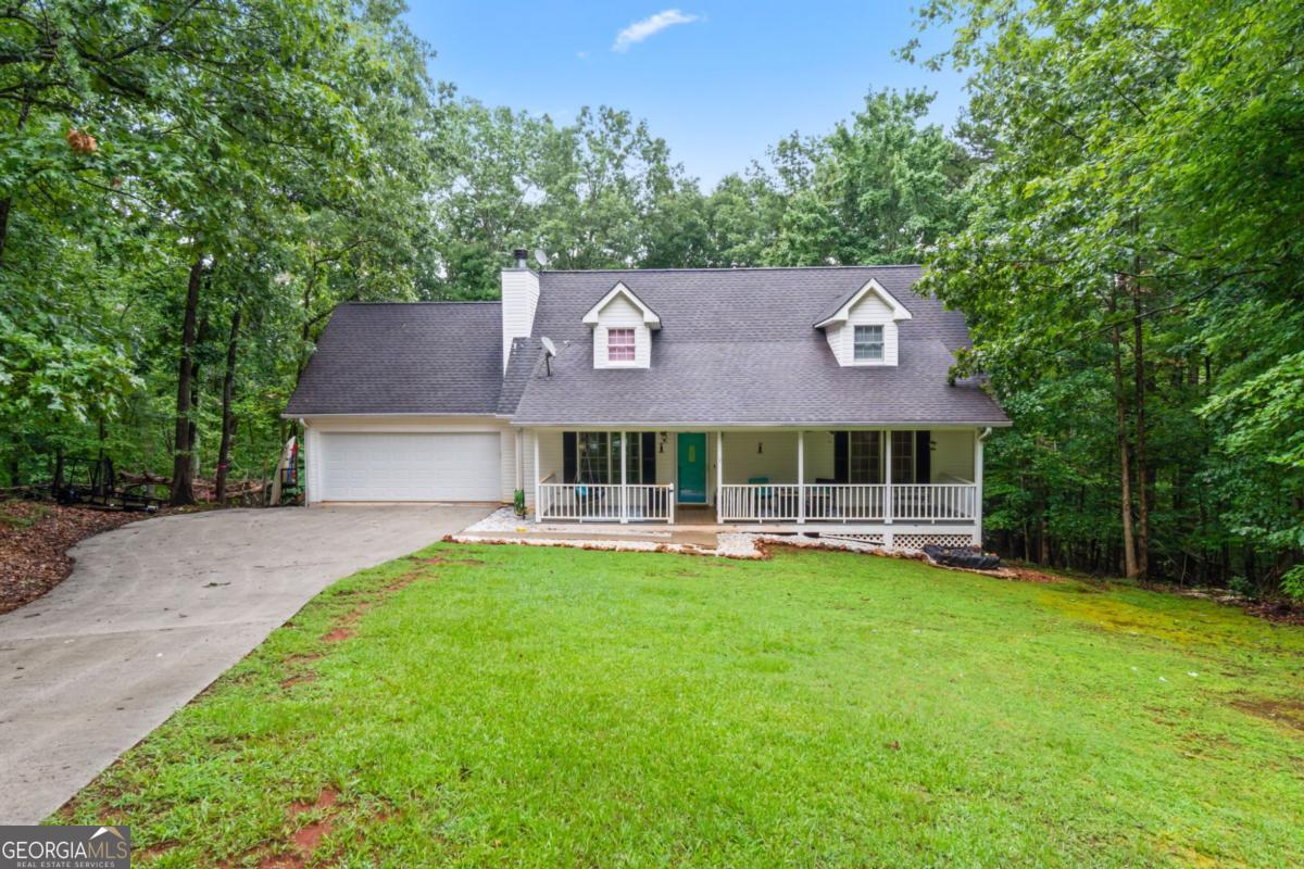 Located in the highly sought-after Sky Country neighborhood, this charming 4 bed / 3.5 bath home offers 2,158 sq ft on the main levels plus a finished basement (1200 sq ft) with bonus room-ideal as an in-law suite with its own sink, cabinets, and private space. The main level features a spacious living room with a gas fireplace, a bright kitchen with a double oven, and a large master suite with HUGE walk-in closet, double vanities, separate commode, and a shower/tub combo. Laundry and master are both on the main floor. Enjoy morning coffee on the inviting front porch or entertain on the back deck overlooking a fenced-in 0.74-acre lot. All closets are extra deep for incredible storage, and the basement includes both finished living space and an unfinished room perfect for storage. BRAND NEW HVAC, and just minutes to shopping, schools, and downtown Dahlonega-this one checks all the boxes!
