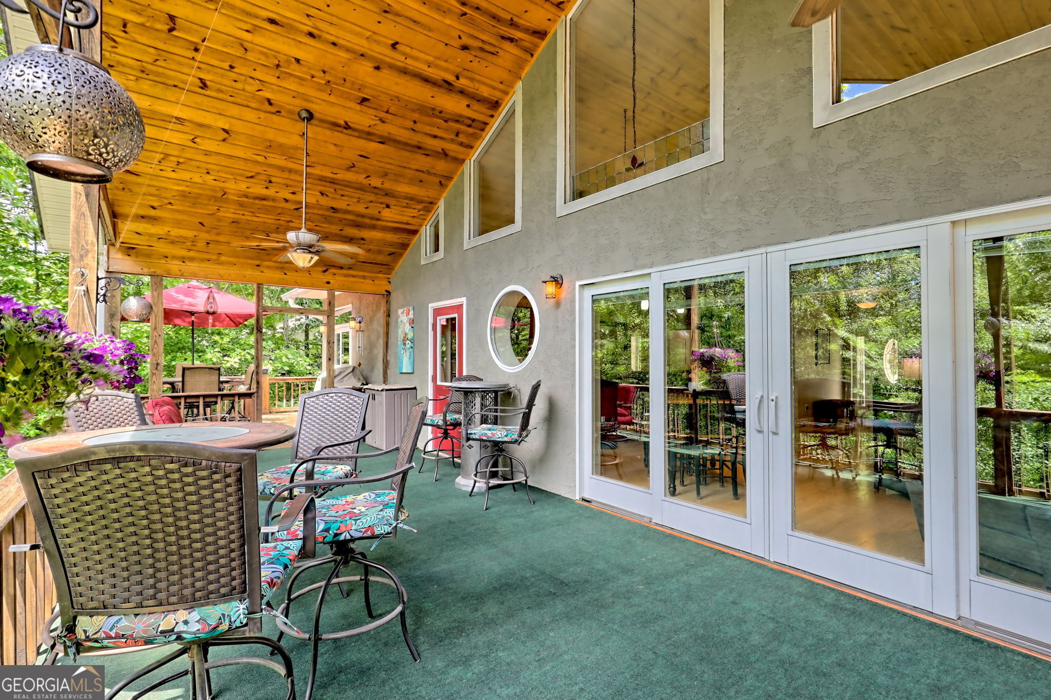Start your lake-life on Lake Nottely with this energy-efficient 4BR/3BA home featuring a full separate apartment on the terrace level. Enjoy 121' of lake frontage, a floating dock, stream-side lot, and a studio cottage by the water with large deck and eco-friendly water closet. There is also a fire pit area along the pathway to the dock. Open-concept Great Room flows to a 60' wide lake-facing deck, filled with natural light from large windows and Pella sliders. Gourmet kitchen with Cambria Quartz, pantry, and raised dishwasher. Home built with 12" ECO Block walls (R-Factor 50) for superior insulation. Oversized 2-car garage includes heated/cooled workshop. Home includes furnishings (few exceptions), golf cart, boat, and water toys. New roof July 2024. Located in one of Lake Nottely's most sought-after neighborhoods. If it is a view you are looking for, trees can be cleared.