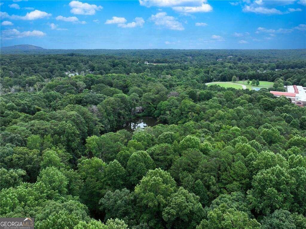 This 8.6 acre lot is perfect for building a community and endless opportunities. Already positioned in an established residential area The residential zoning and availability of public water make it suitable for development. Currently zoned residential but Covington Highway is known for commercial properties and opportunities.