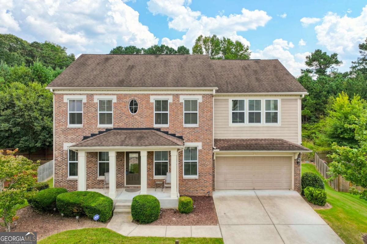 This home is an estate sale home with a spacious floor plan with 5 bedrooms & 3 full baths on a full basement stubbed for a bath. Great island kitchen features ss appliances, stained cabinets, granite counters, tile back splash, breakfast area & recessed lighting! Family room includes fireplace with gas logs & open to the kitchen. Hardwood floors in the foyer, dining room, & kitchen! Guest bedroom and full bath on the main level! Master suite features over-sized bedroom w/tray ceiling & sitting area, bath with double vanity, garden tub w/tile surround, tile shower & walk-in closet. Upper level also includes three bedrooms, full bath, and a huge media/recreation room at top of staircase. Laundry room is on the main level near kitchen. Deck overlooks level backyard! Active quiet family community with an amenities package consisting of a pool & playground! Convenient location, close to the silver comet trail and downtown Powder Springs!