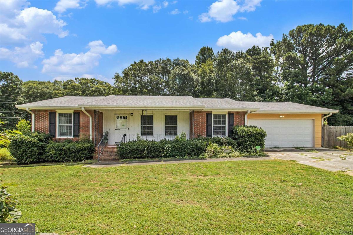 Freshly painted and move-in ready! Situated on a huge corner lot, this home features new sliding doors from both the family room and owner's suite leading to the deck, perfect for relaxing or entertaining. Enjoy the updated owner's bathroom, low-maintenance brick exterior, and new roof and HVAC systems for peace of mind. Inside, you'll find a separate living room, dining room, and family room, offering plenty of flexible living space. The white eat-in kitchen includes a spacious dining area, and all appliances are included. Outside, there's lots of parking with a convenient turn-around and a large fenced-in yard-all with no HOA. Just needs your personal touch!